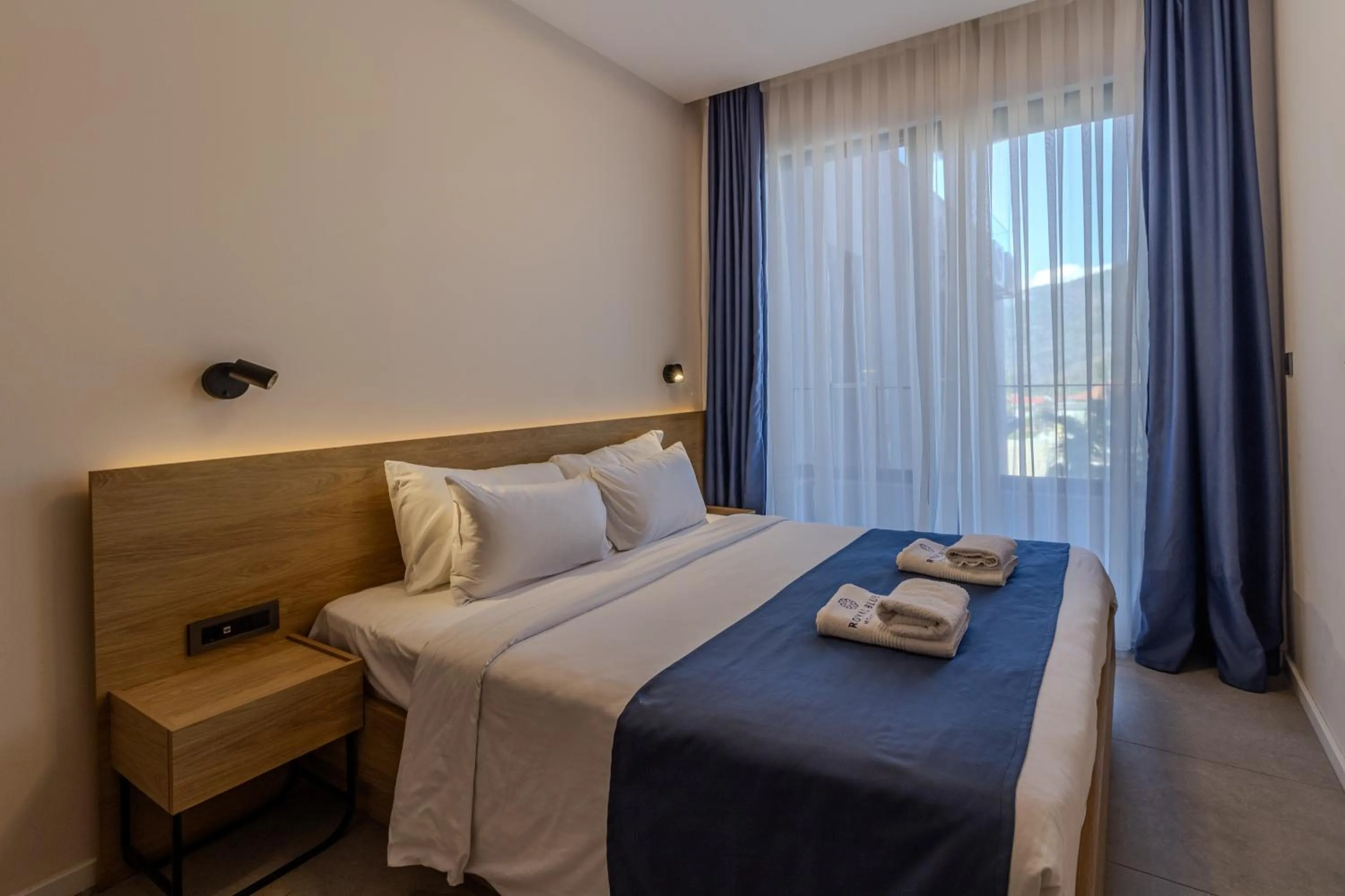 Bed in Royal Blue Resort & Residences