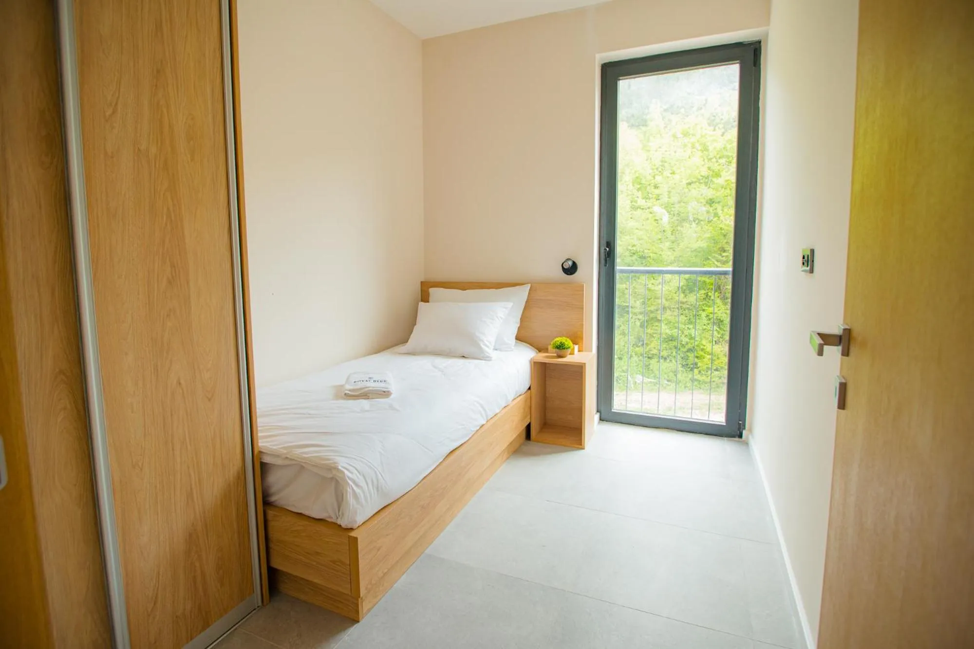 Bed in Royal Blue Resort & Residences