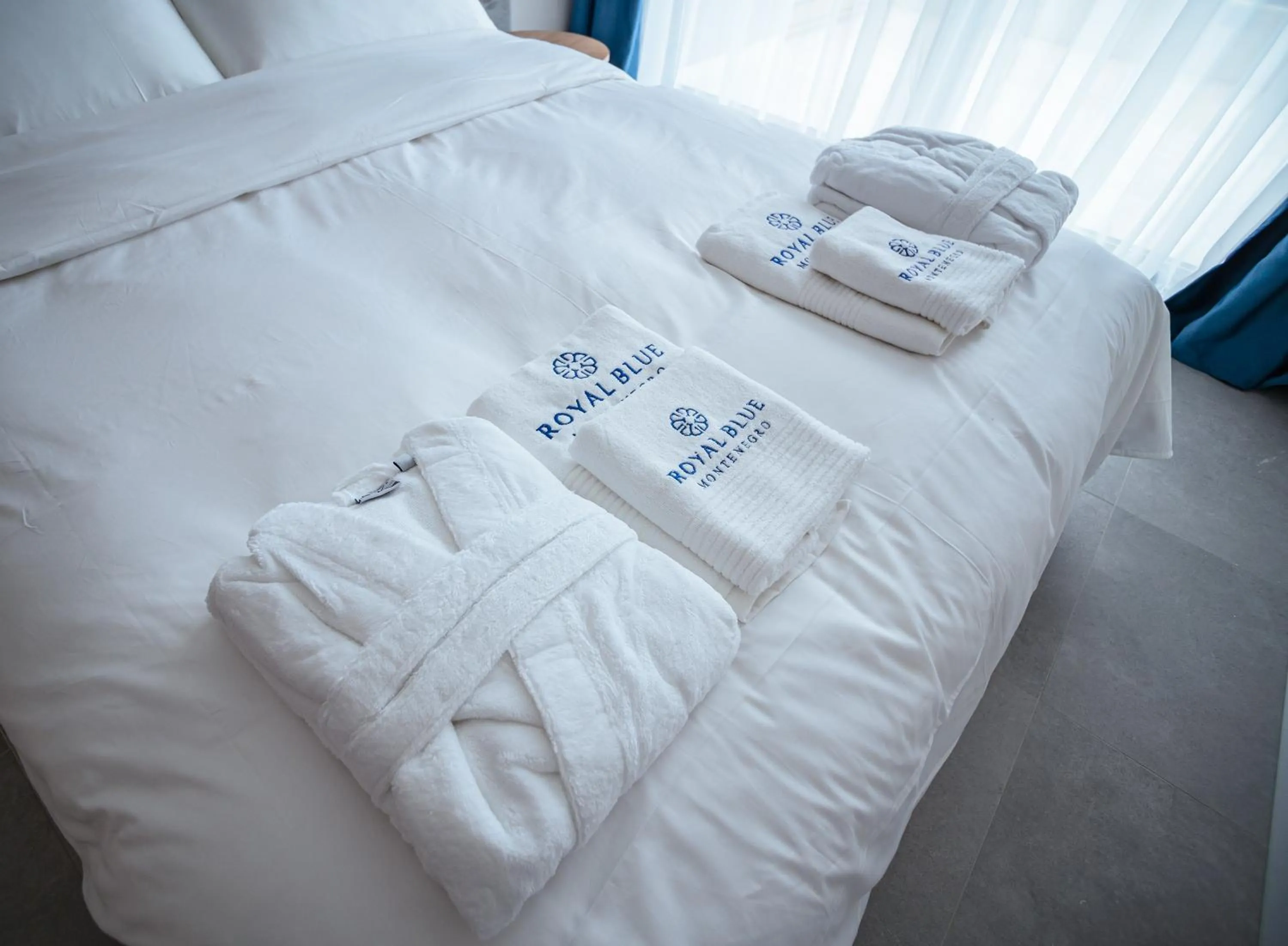 Bed in Royal Blue Resort & Residences