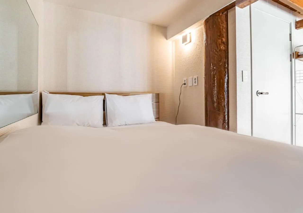 Bed in Woomigwan Hotel