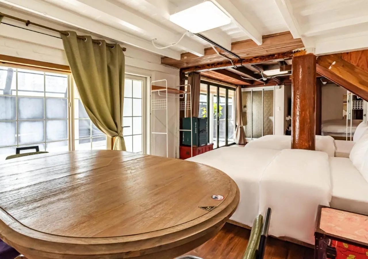 Seating area, Bed in Woomigwan Hotel