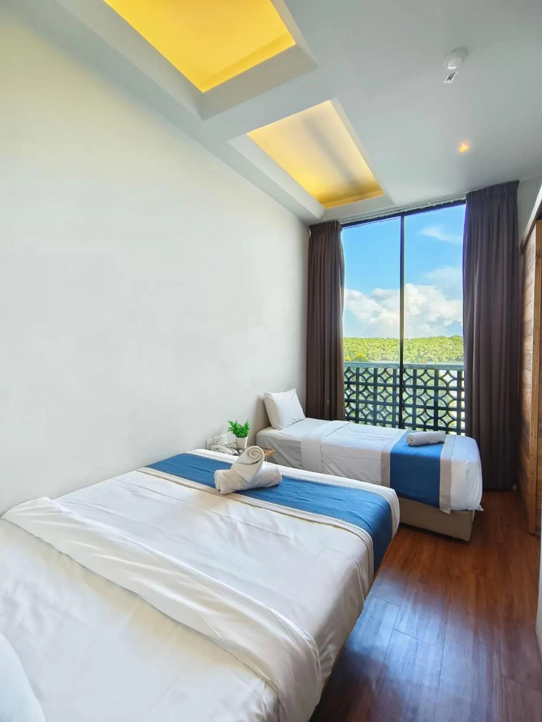 Photo of the whole room, Bed in The Riverbank Hotel By MRVJ Business