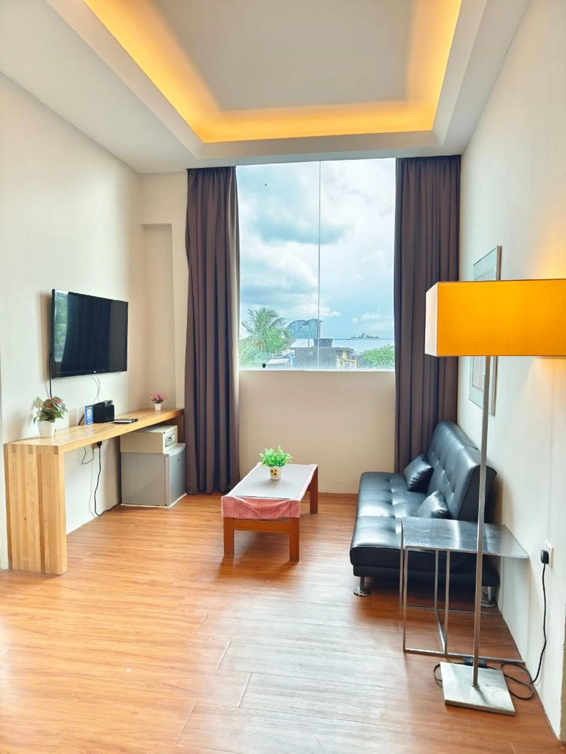 Bedroom in The Riverbank Hotel By MRVJ Business