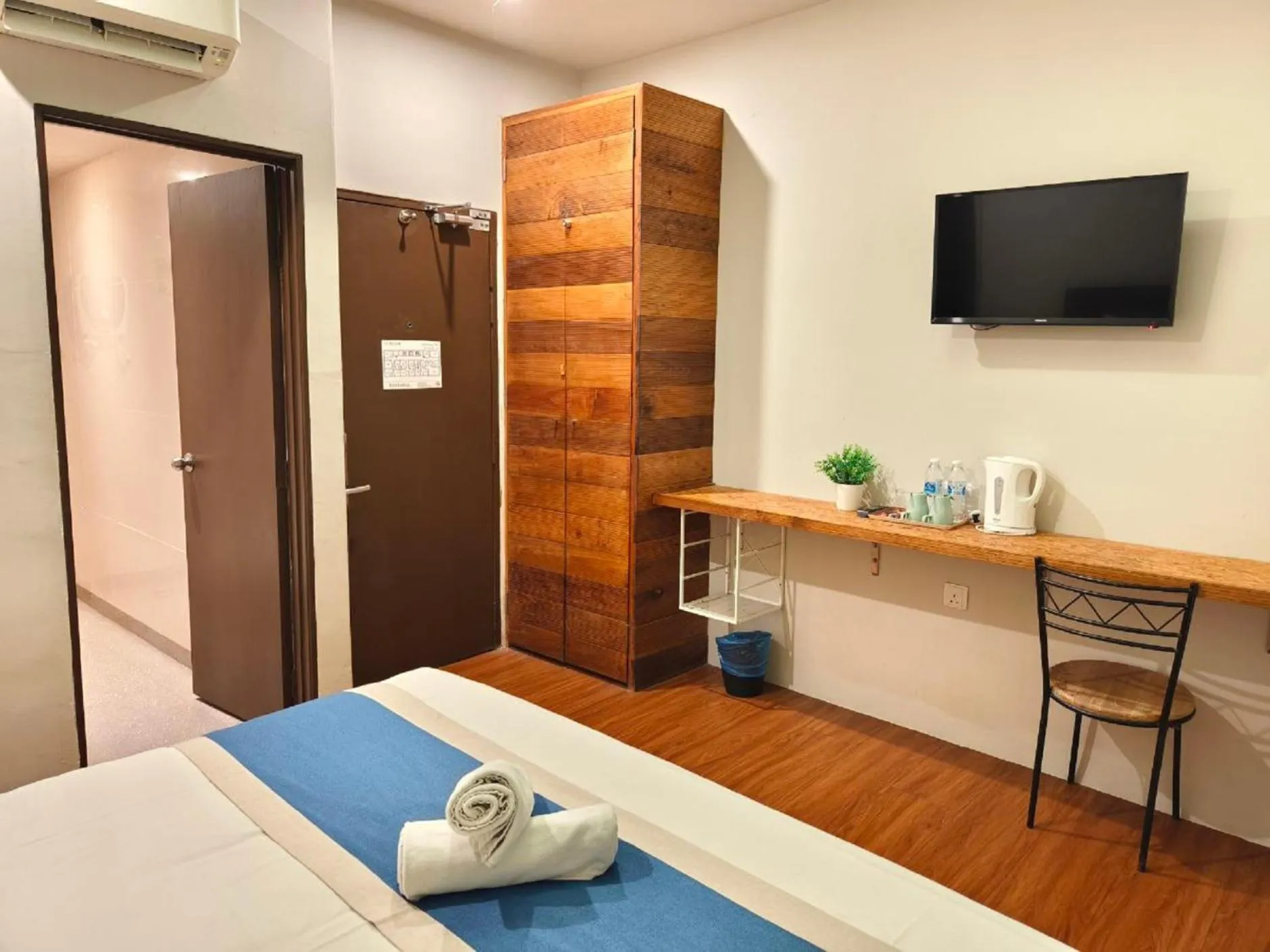 towels, Bed in The Riverbank Hotel By MRVJ Business