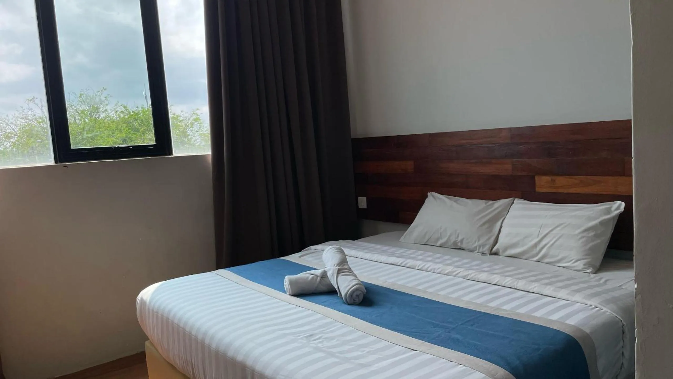 Bed in The Riverbank Hotel By MRVJ Business