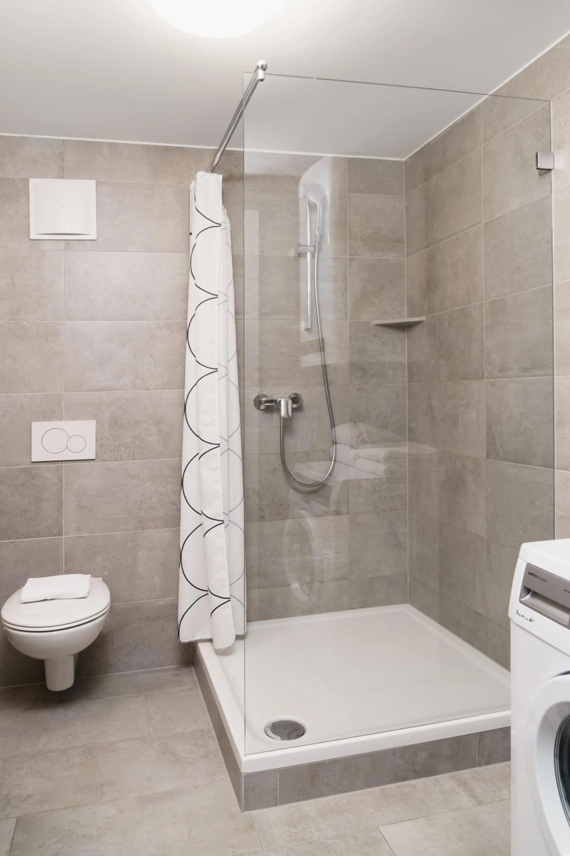 Shower in Apartments Golden Roof by Penz