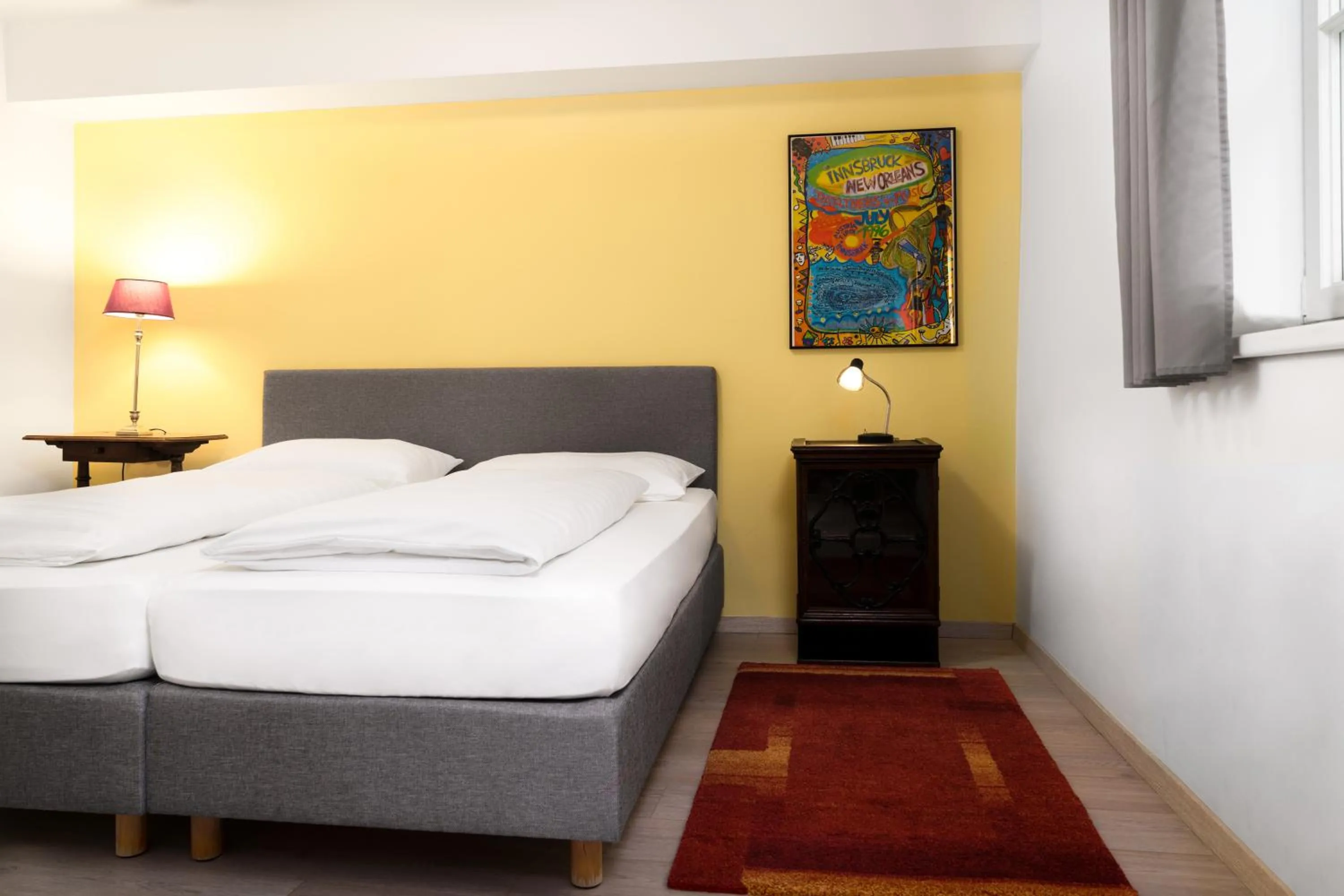Bed in Apartments Golden Roof by Penz