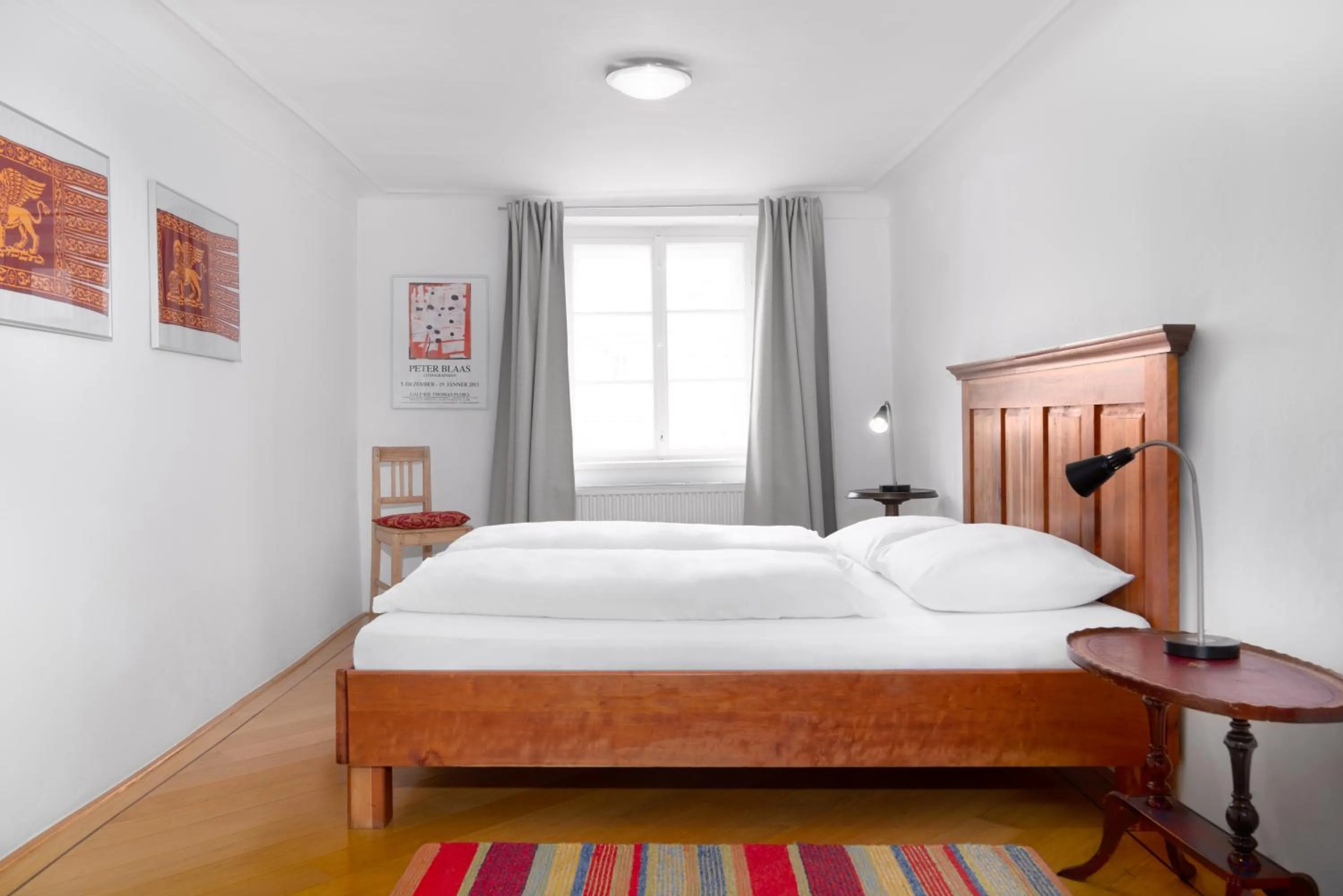 Bed in Apartments Golden Roof by Penz
