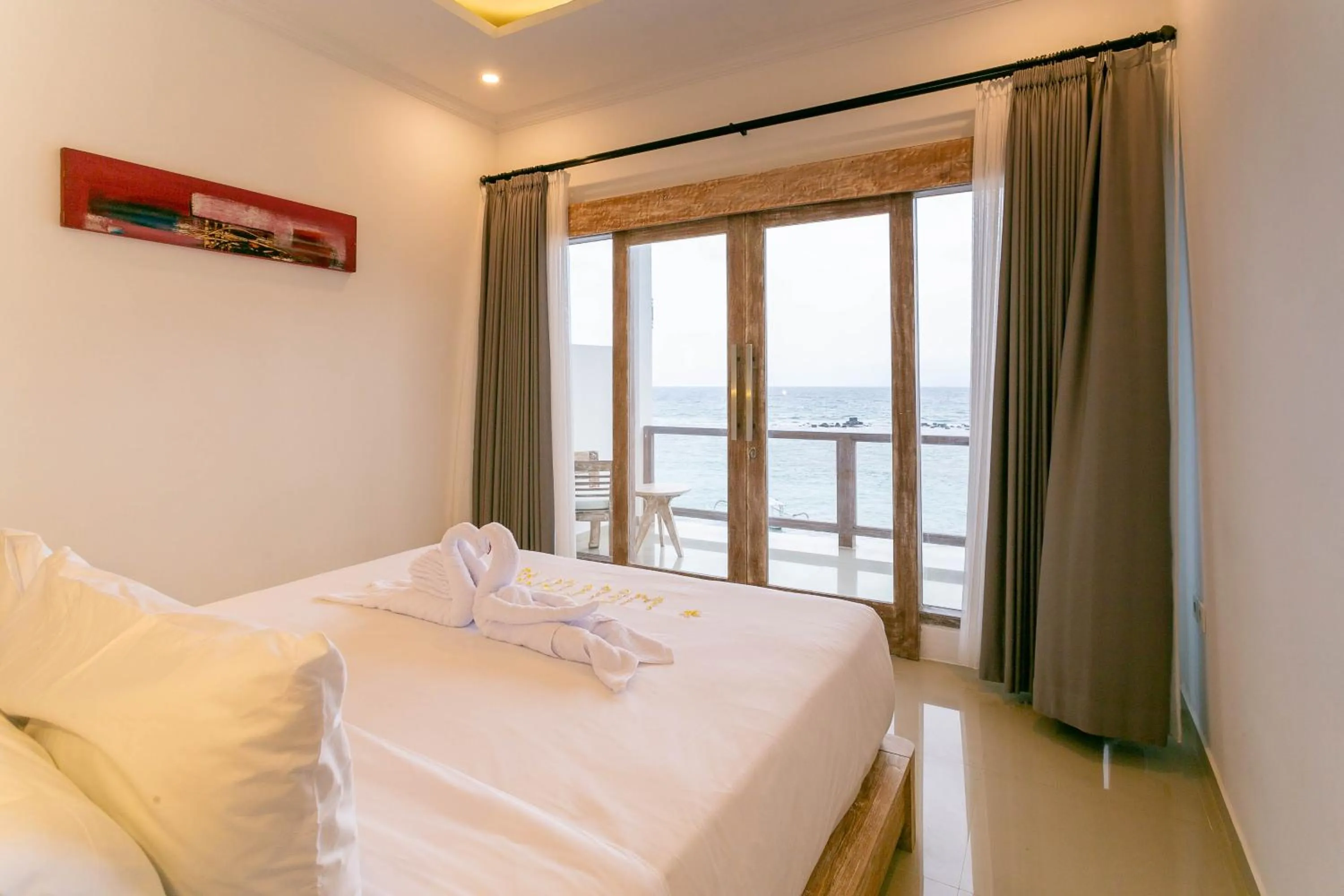 Bed in Utama Villas Beach Front Candidasa