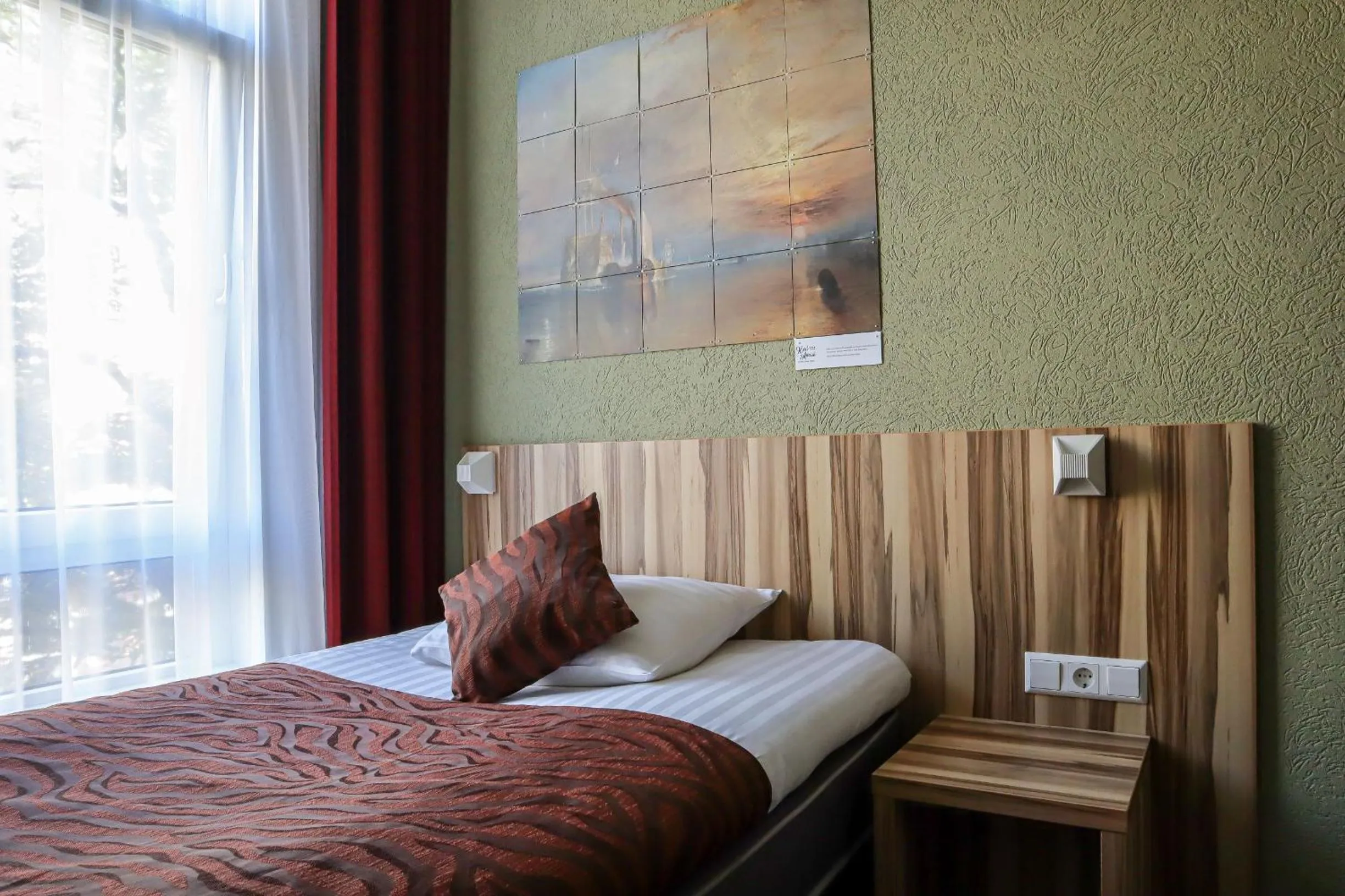 Property building, Bed in Hotel Asterisk, a family run hotel