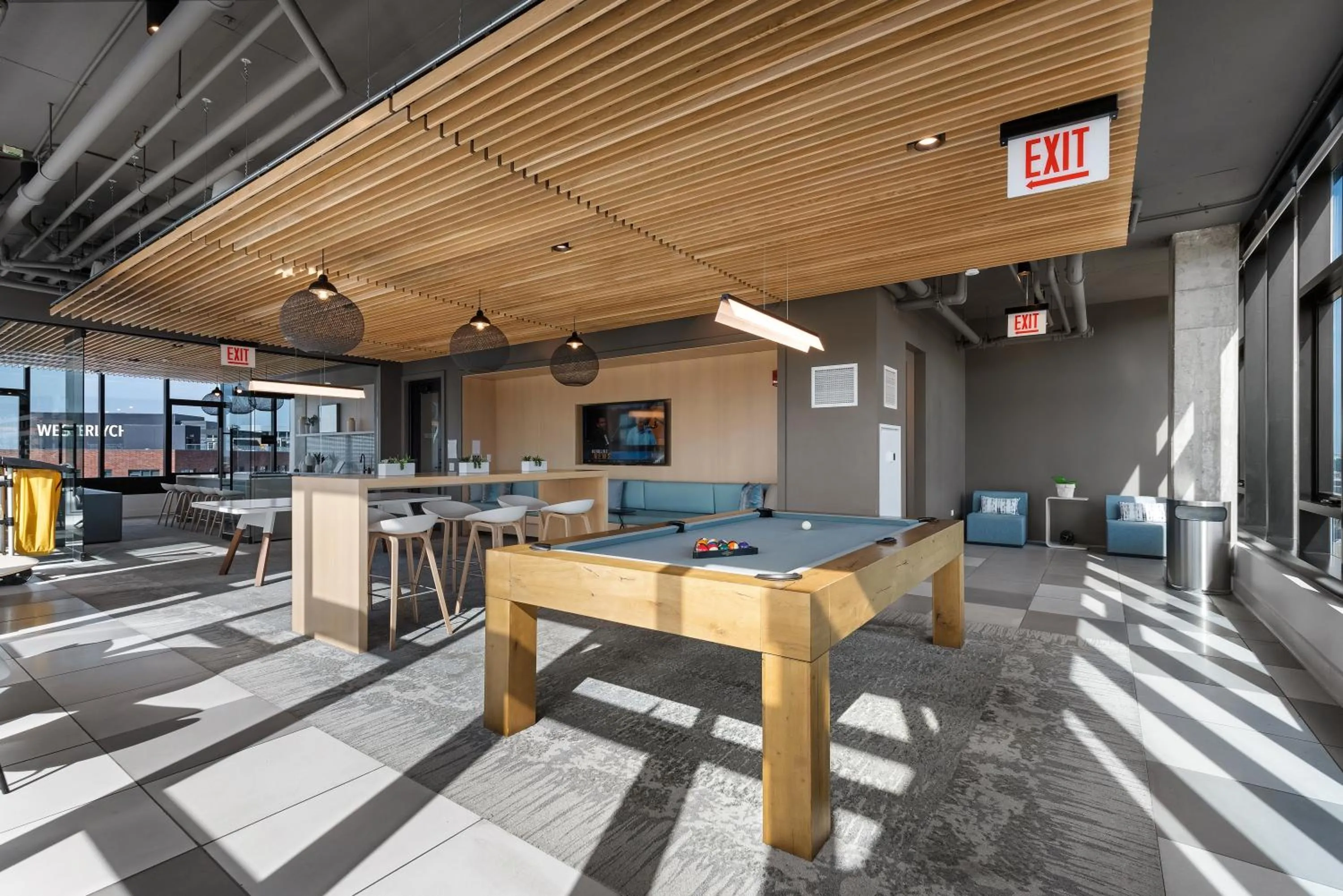 Communal lounge/ TV room in Avenir West Loop Penthouses with Iconic City Views