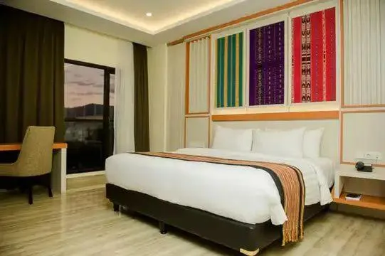 Bed in Hotel Simfony Alor