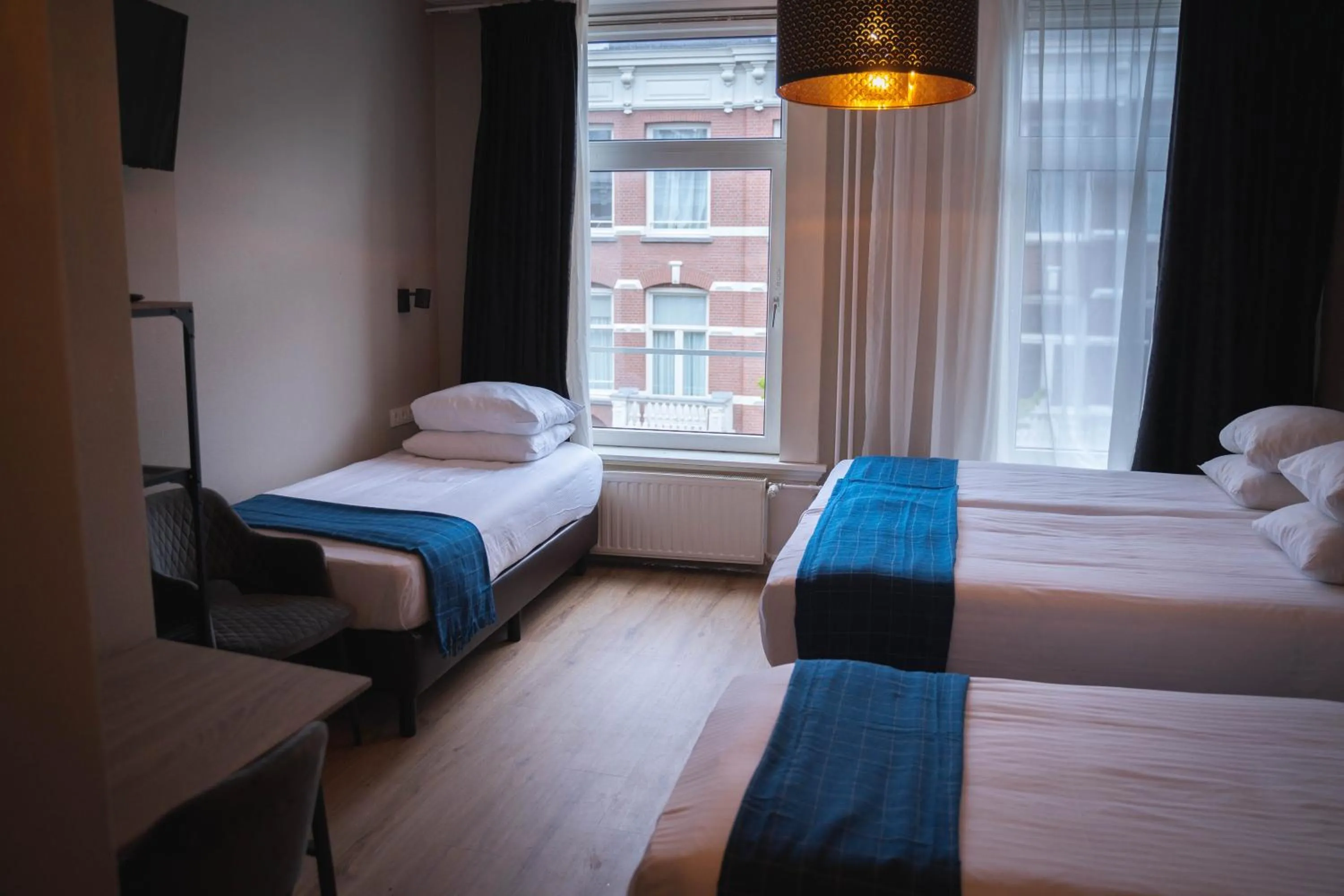 Bed in Hotel Vondel Garden