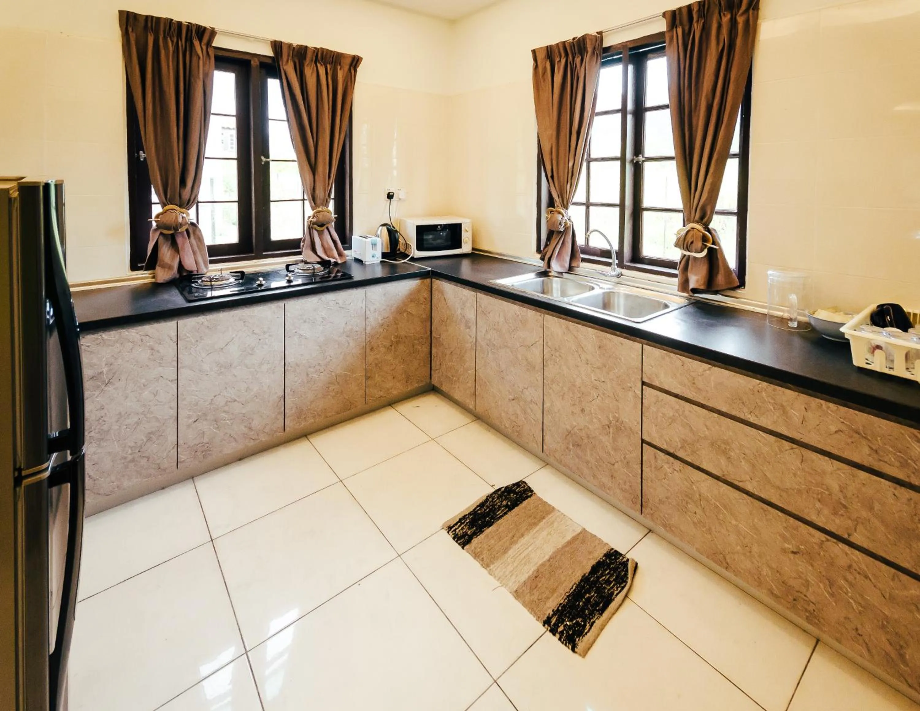 Kitchen or kitchenette in Kertih Damansara Inn