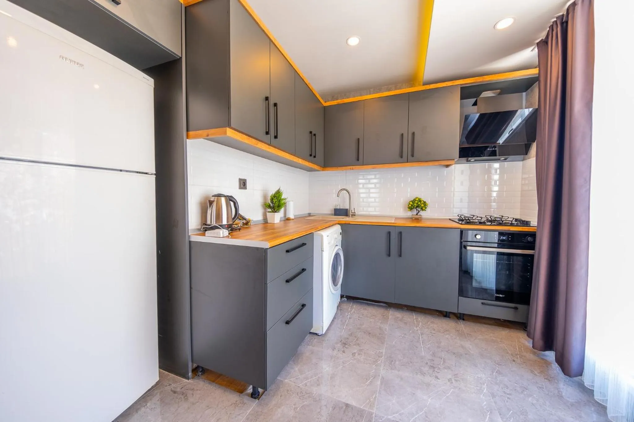 Kitchen or kitchenette in Mrt Suites Lara