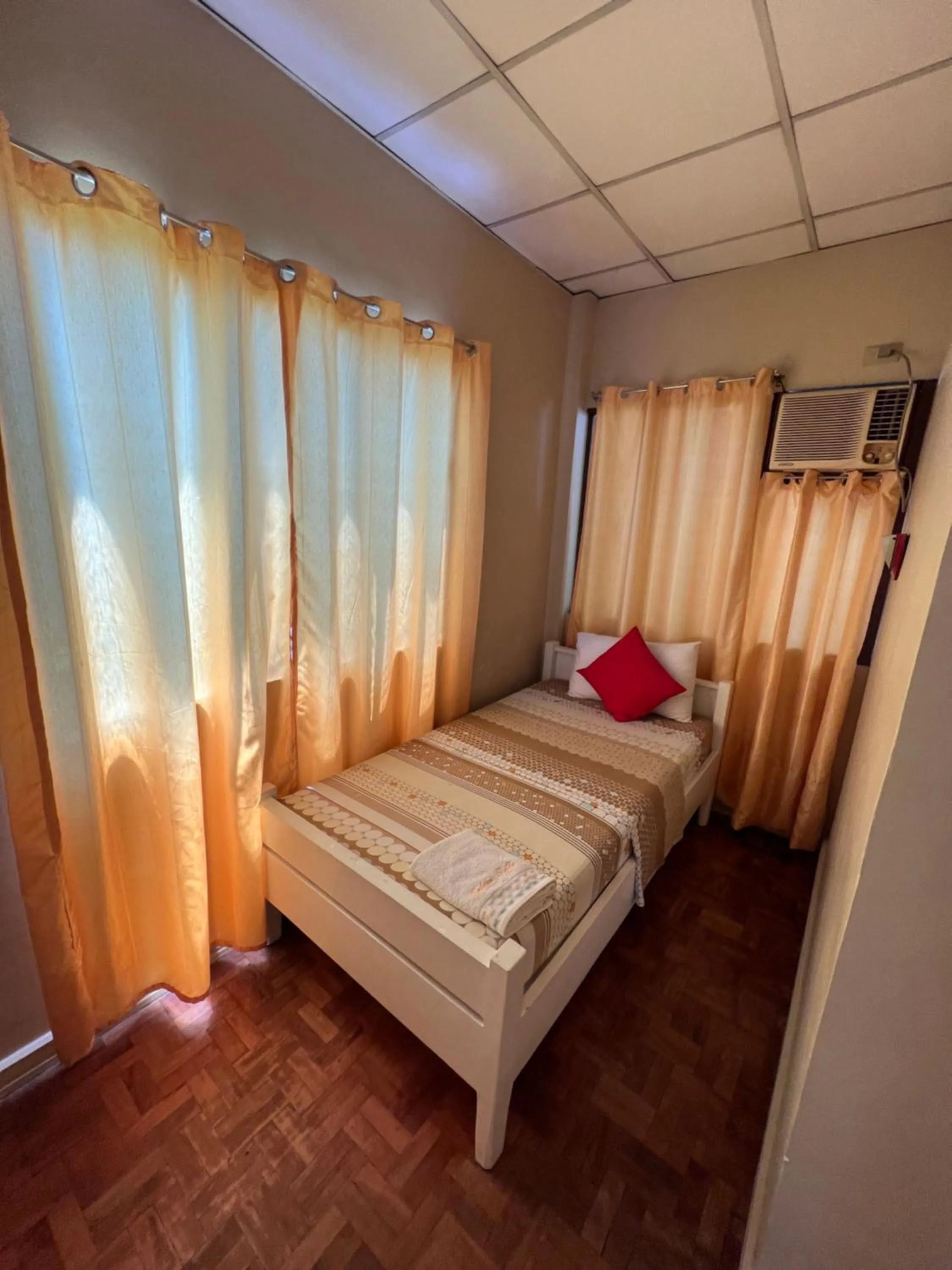 Bed in Golden Belle Apartelle and Suites