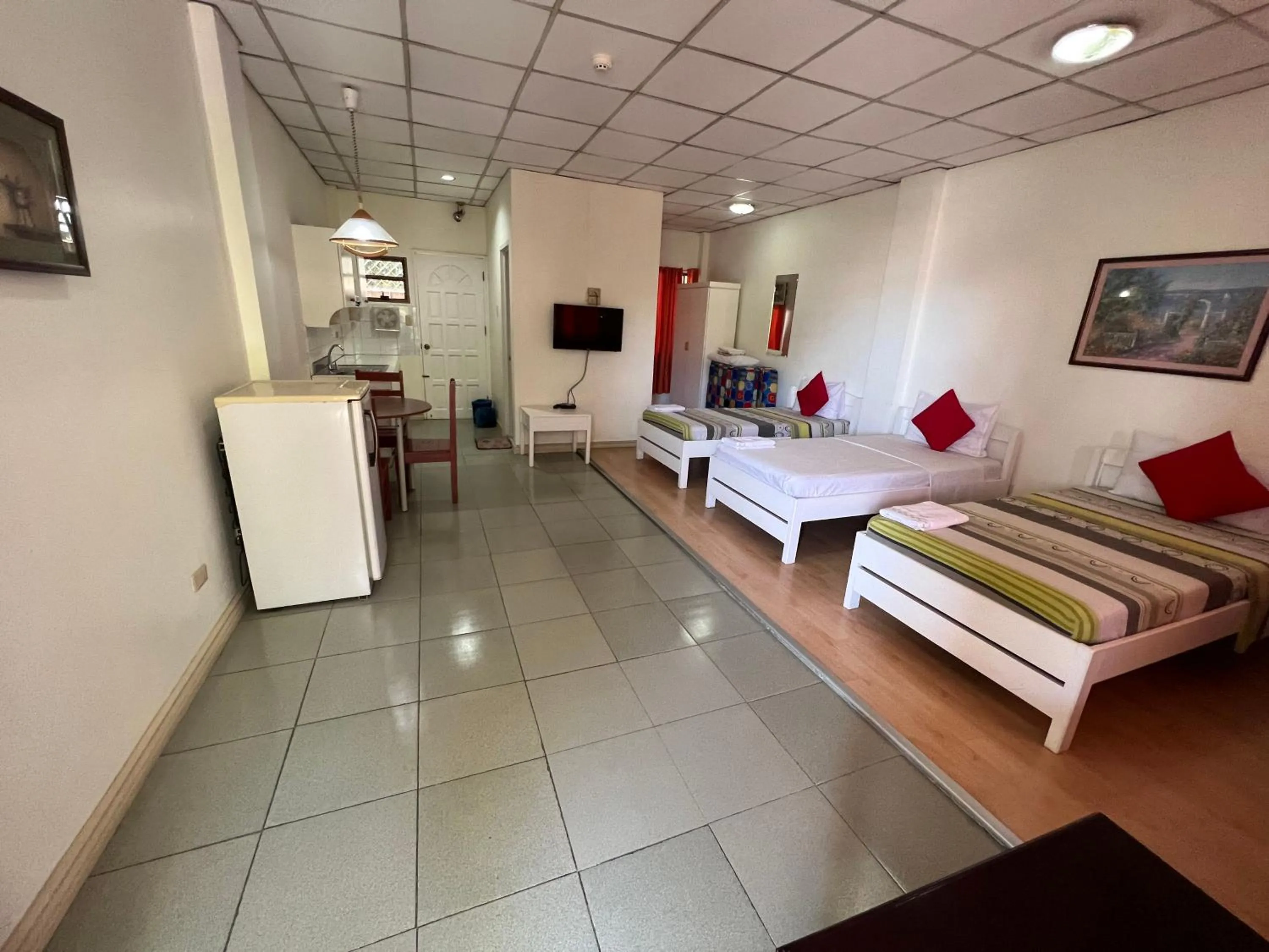 Bed in Golden Belle Apartelle and Suites