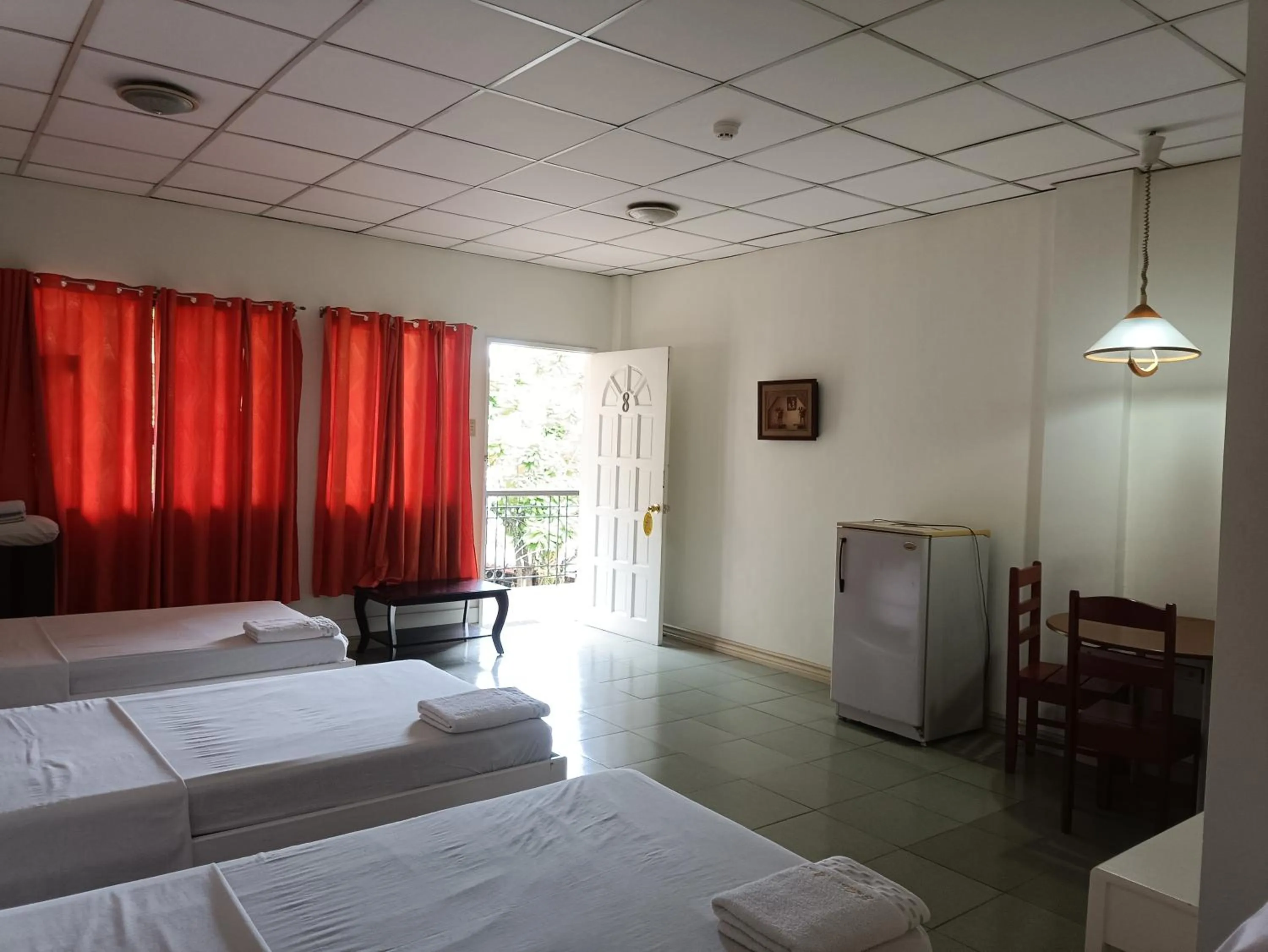 Bed in Golden Belle Apartelle and Suites