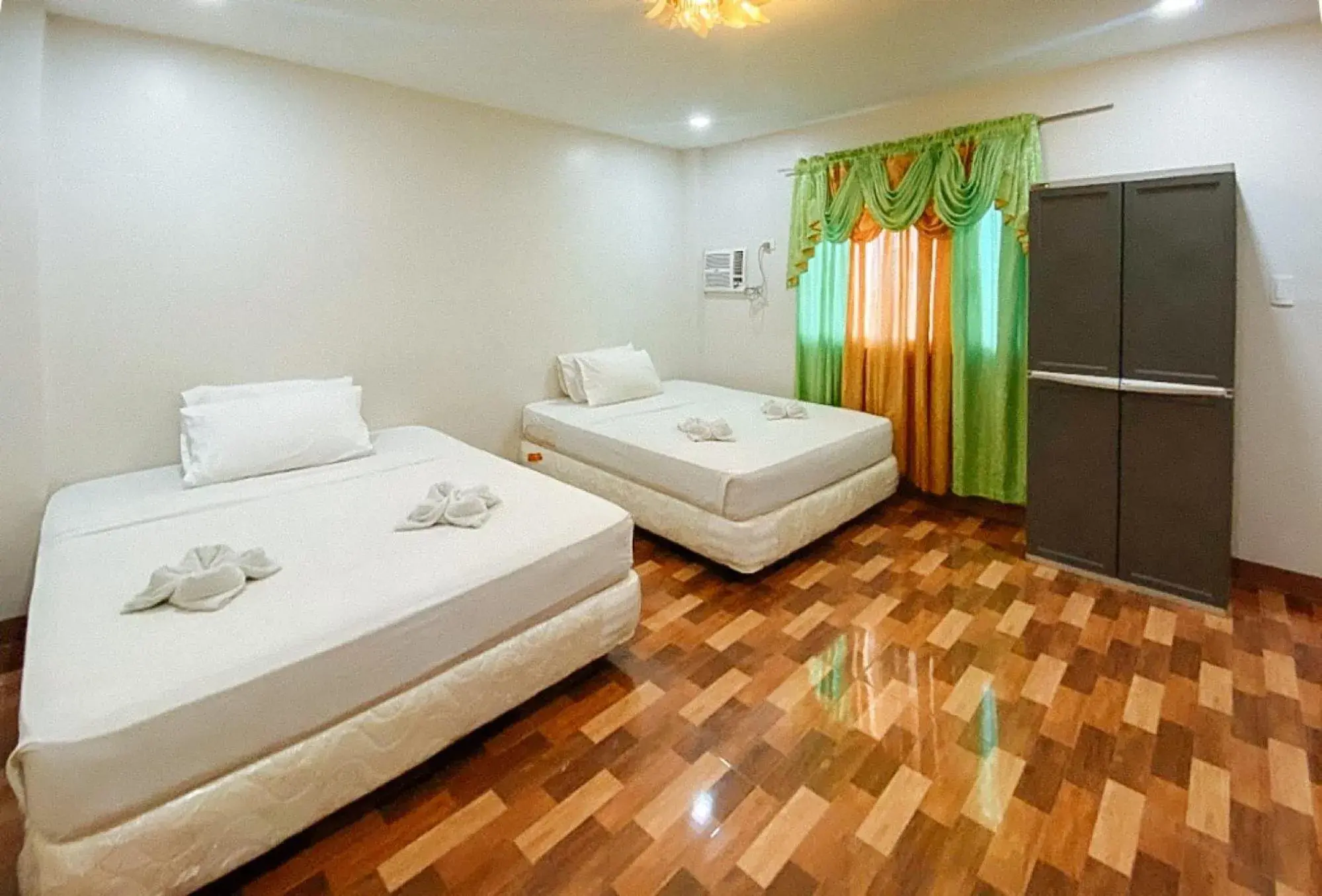 Deluxe Family Room in RedDoorz @ 4ks Pension House Bogo City Cebu Deluxe Family Room in RedDoorz @ 4ks Pension House Bogo City Cebu