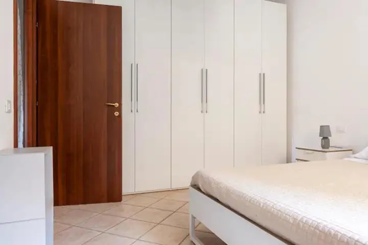 Bedroom, Bed in Casa Nadia - Incantevole appartamento con giardino