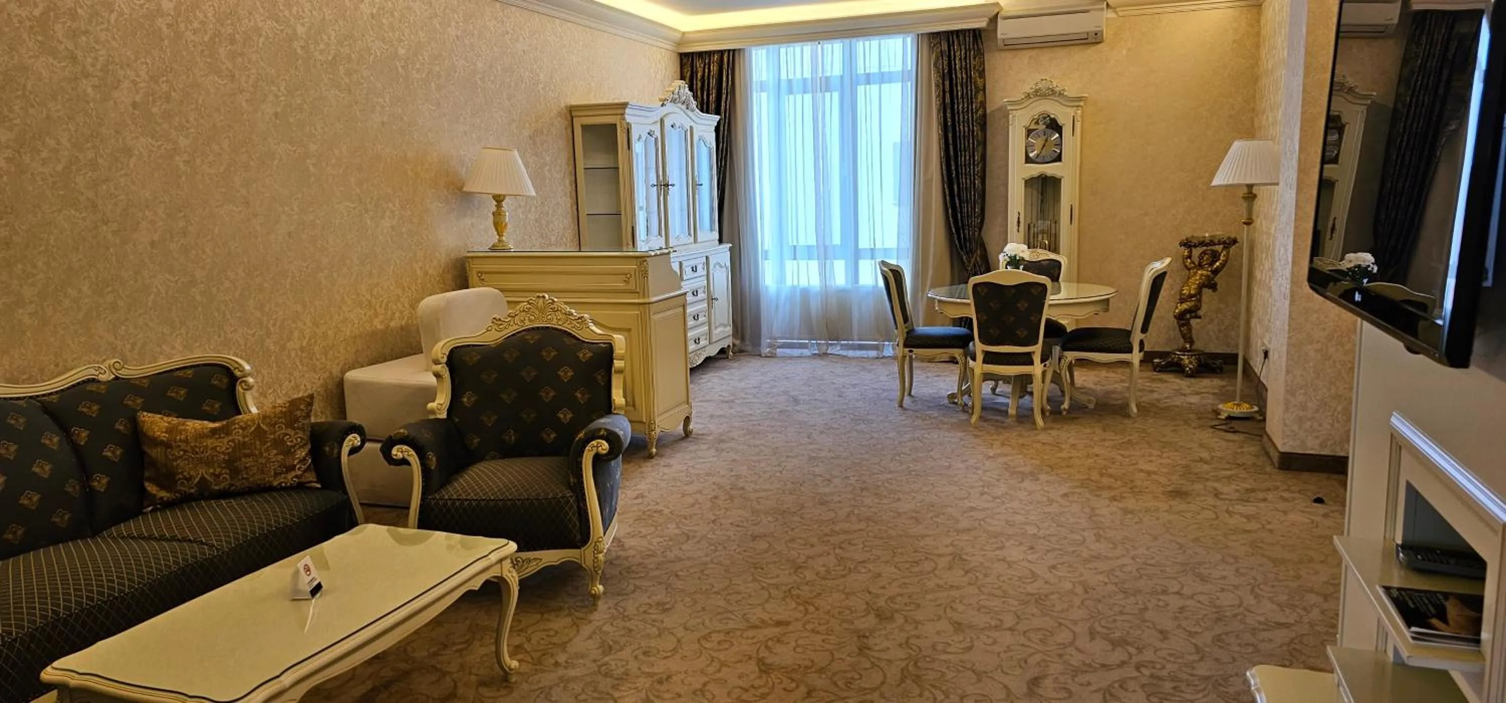 Communal lounge/ TV room in Savoy Hotel