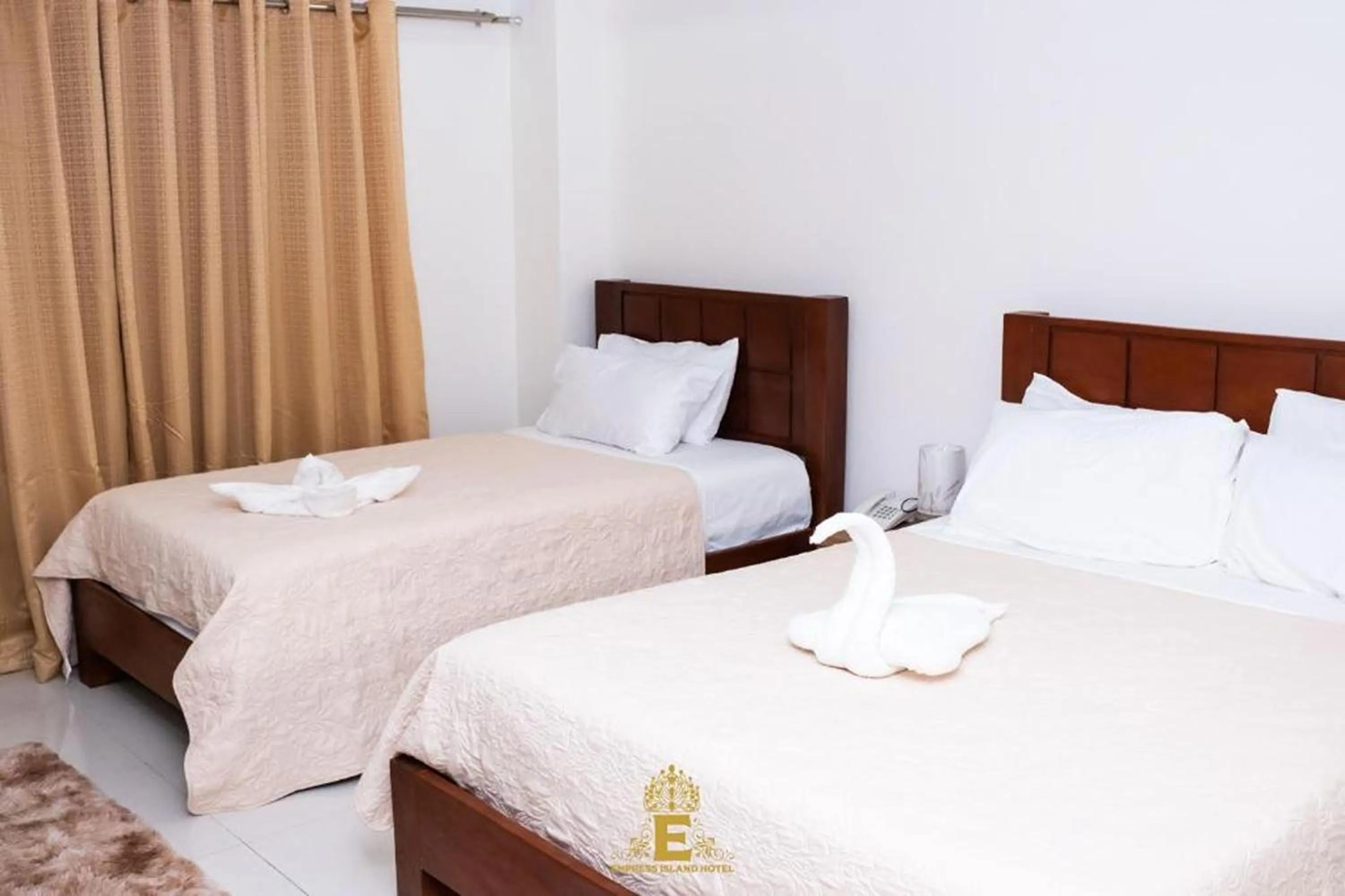 Bed in Empress Island Hotel