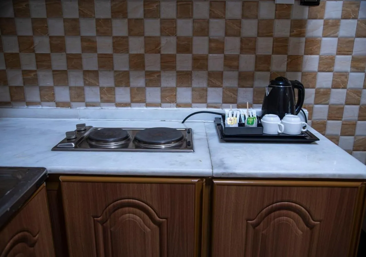Kitchen or kitchenette in Al Nabarees Al Masi Hotel