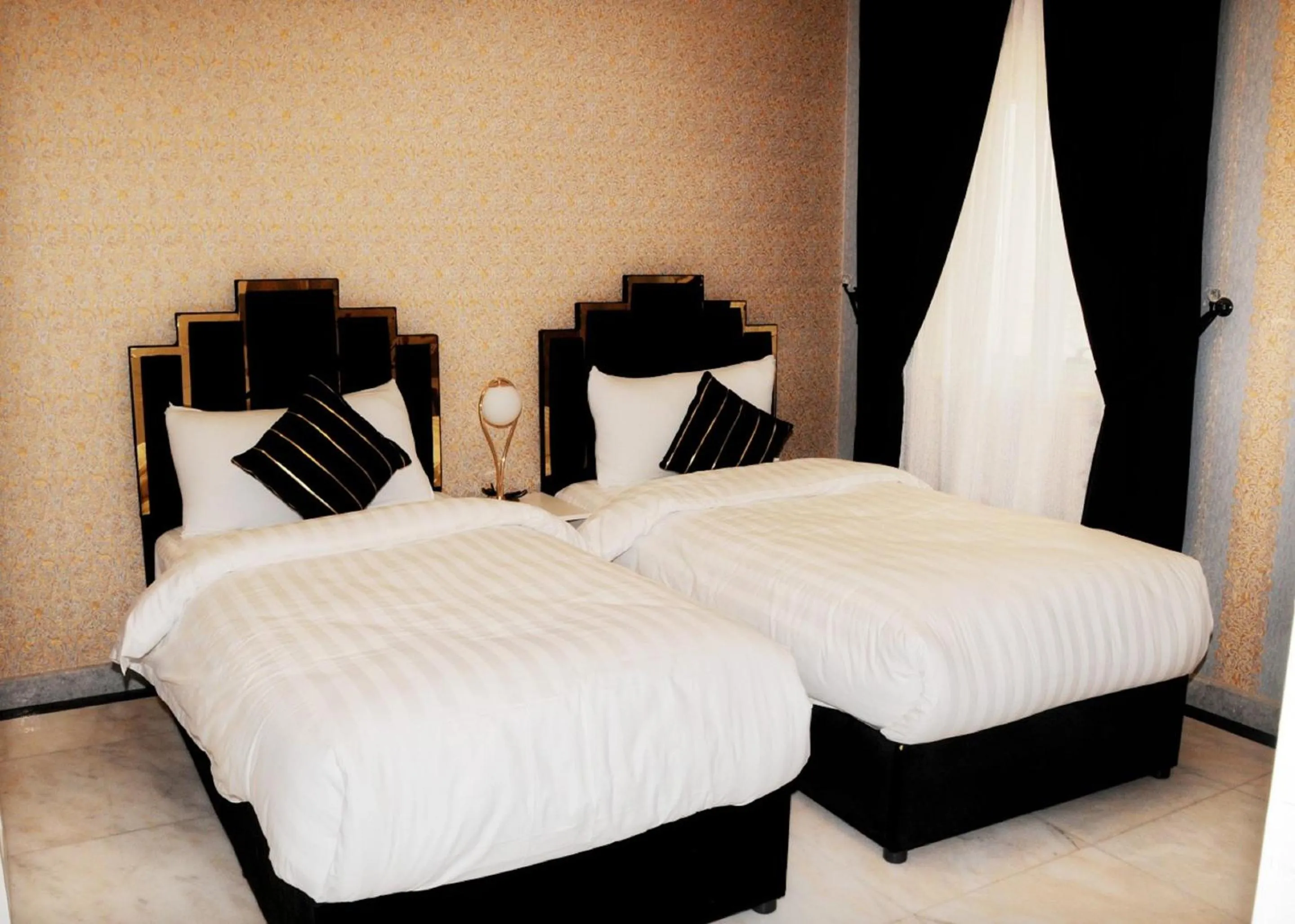 Bed in Al Nabarees Al Masi Hotel