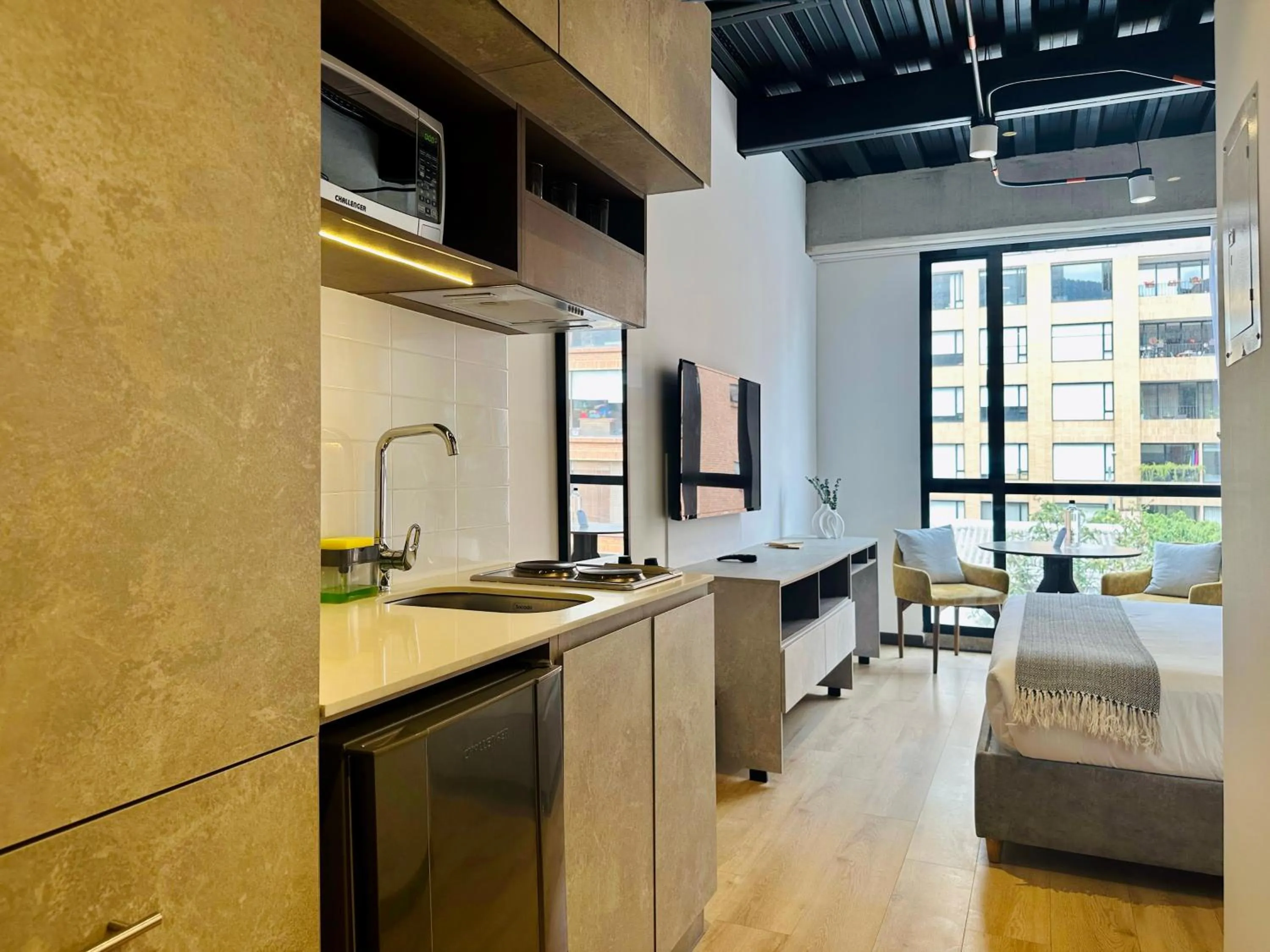 Bed in Beliving by Wynwood House