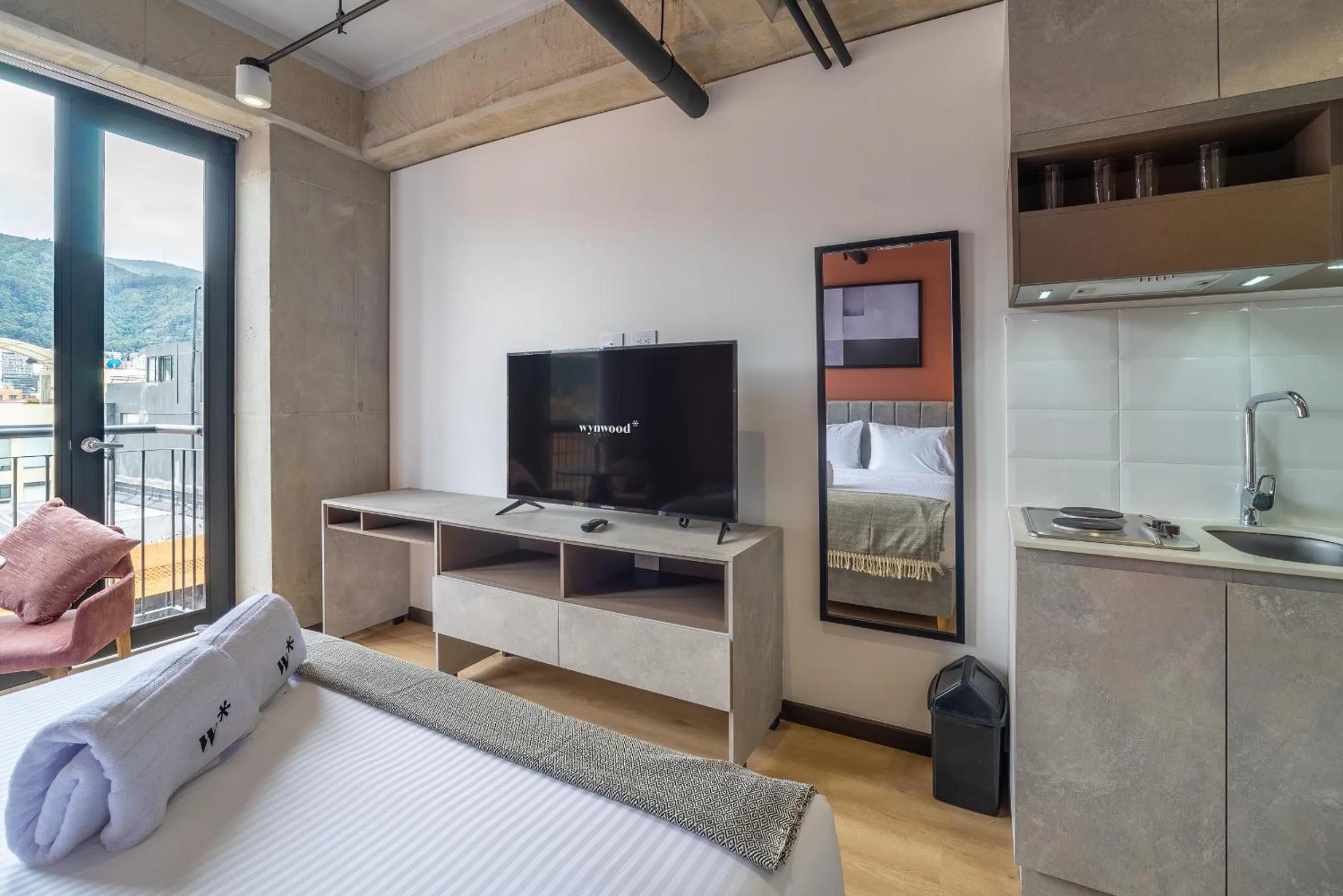 Bed in Beliving by Wynwood House