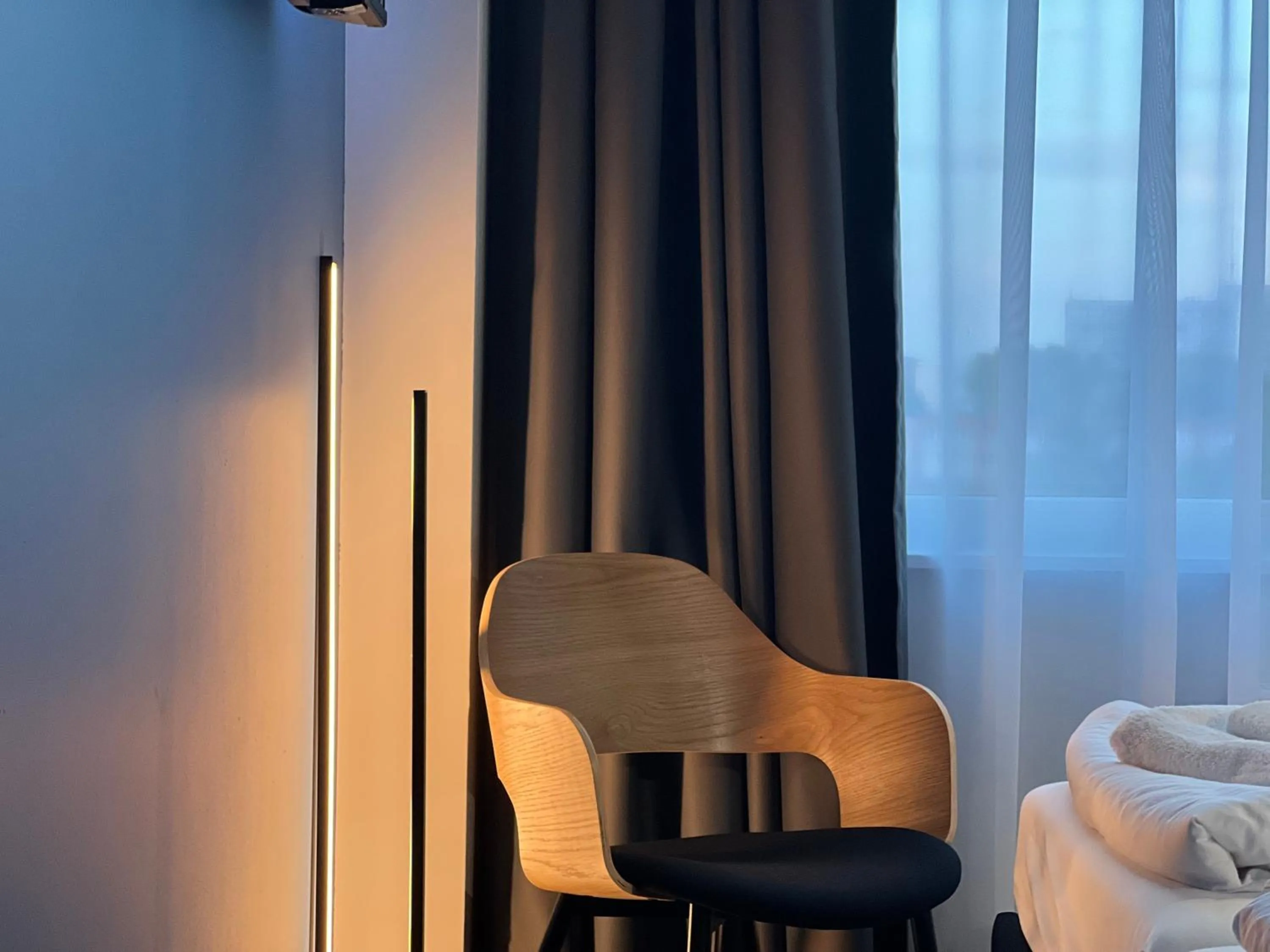 Seating area, Bed in Luna Self Check-in Hotel Klaipeda