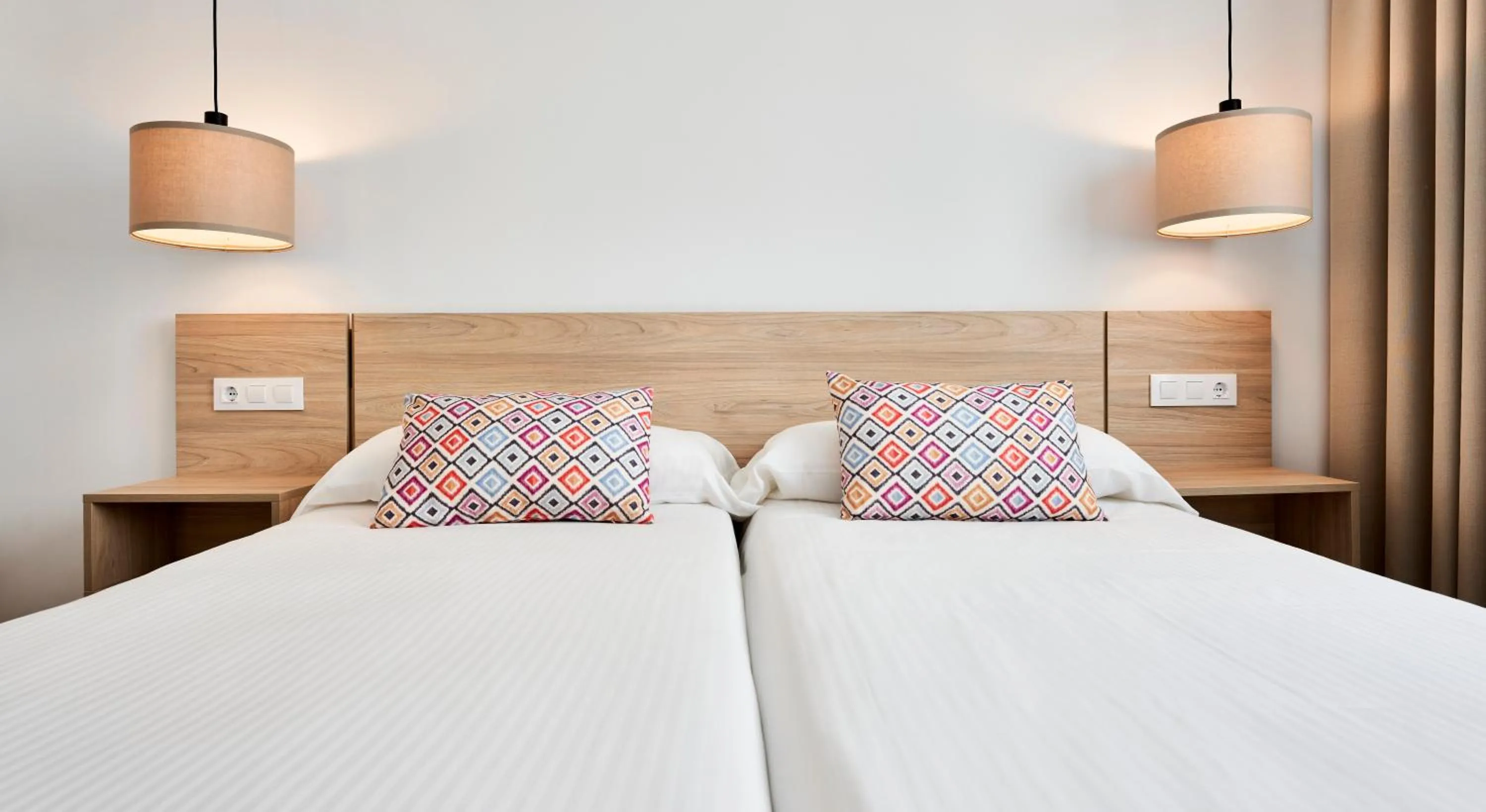 Bed in Apartamentos Sinfony