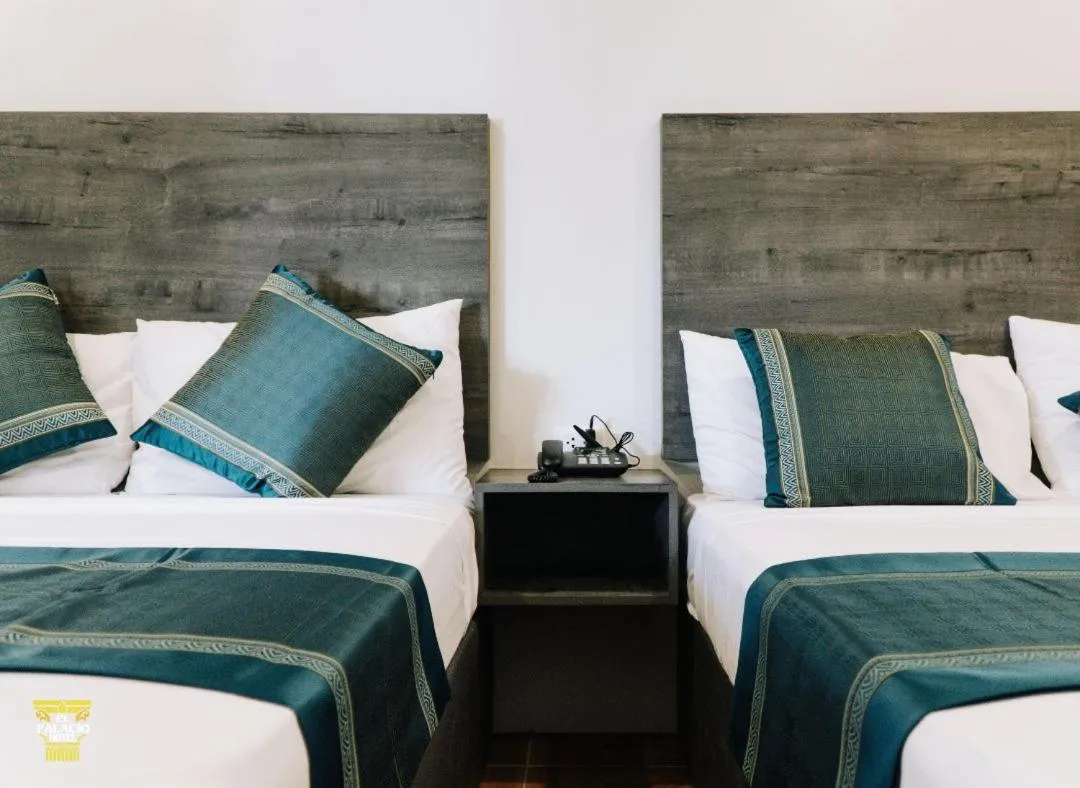 Bed in El Palacio Hotel & Resort