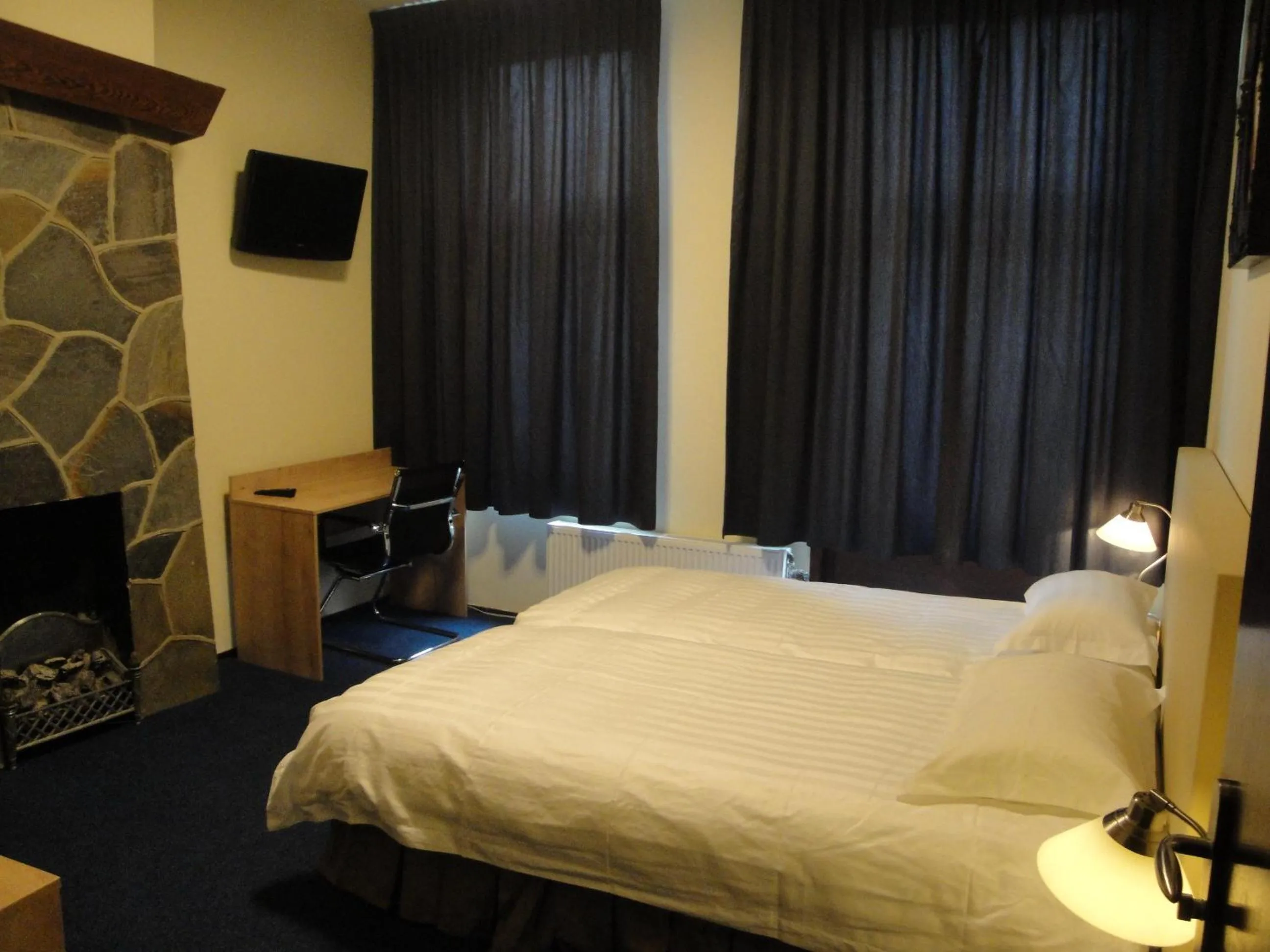 Bed in New City Hotel Scheveningen