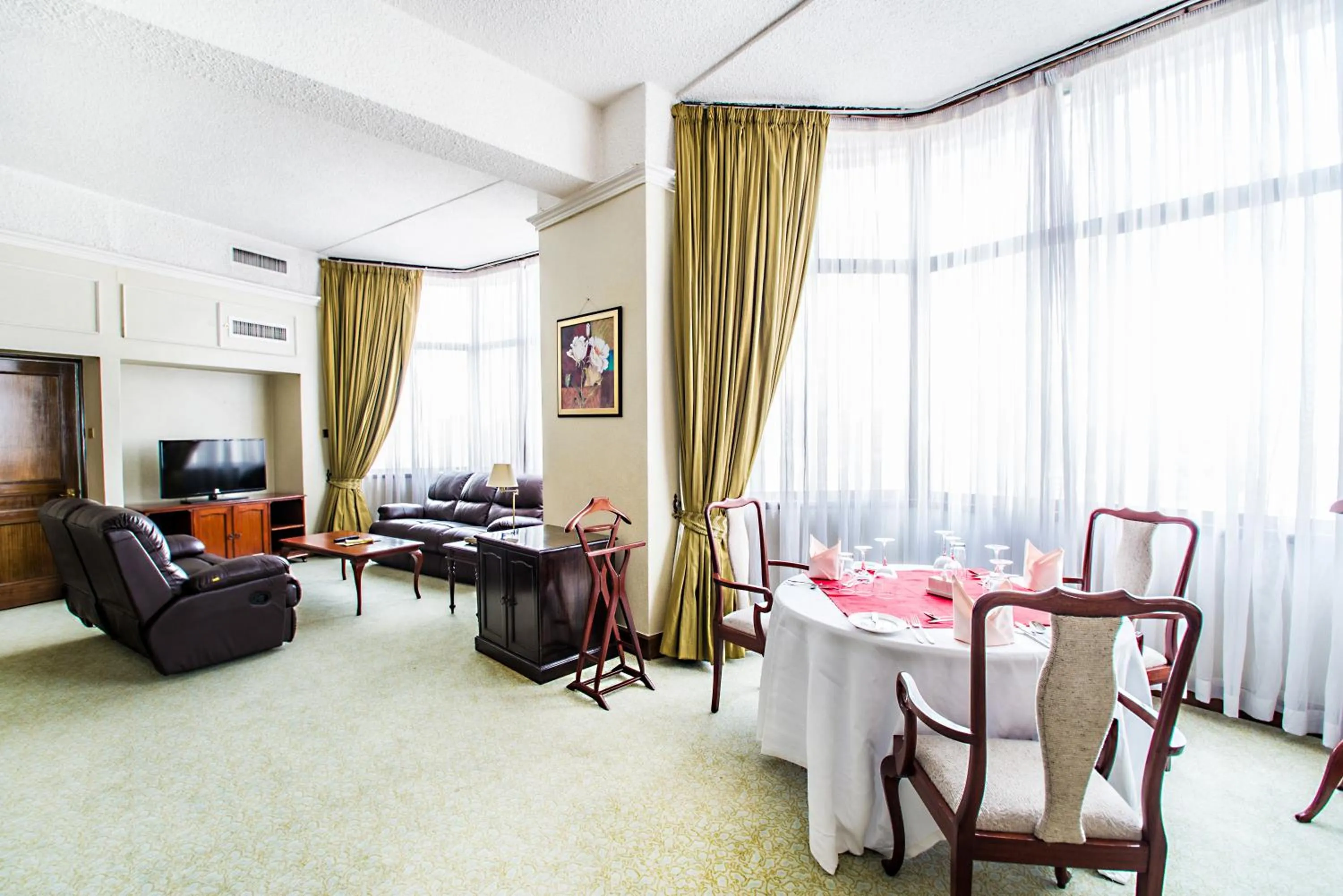 Living room in Nairobi Safari Club by Swiss-Belhotel