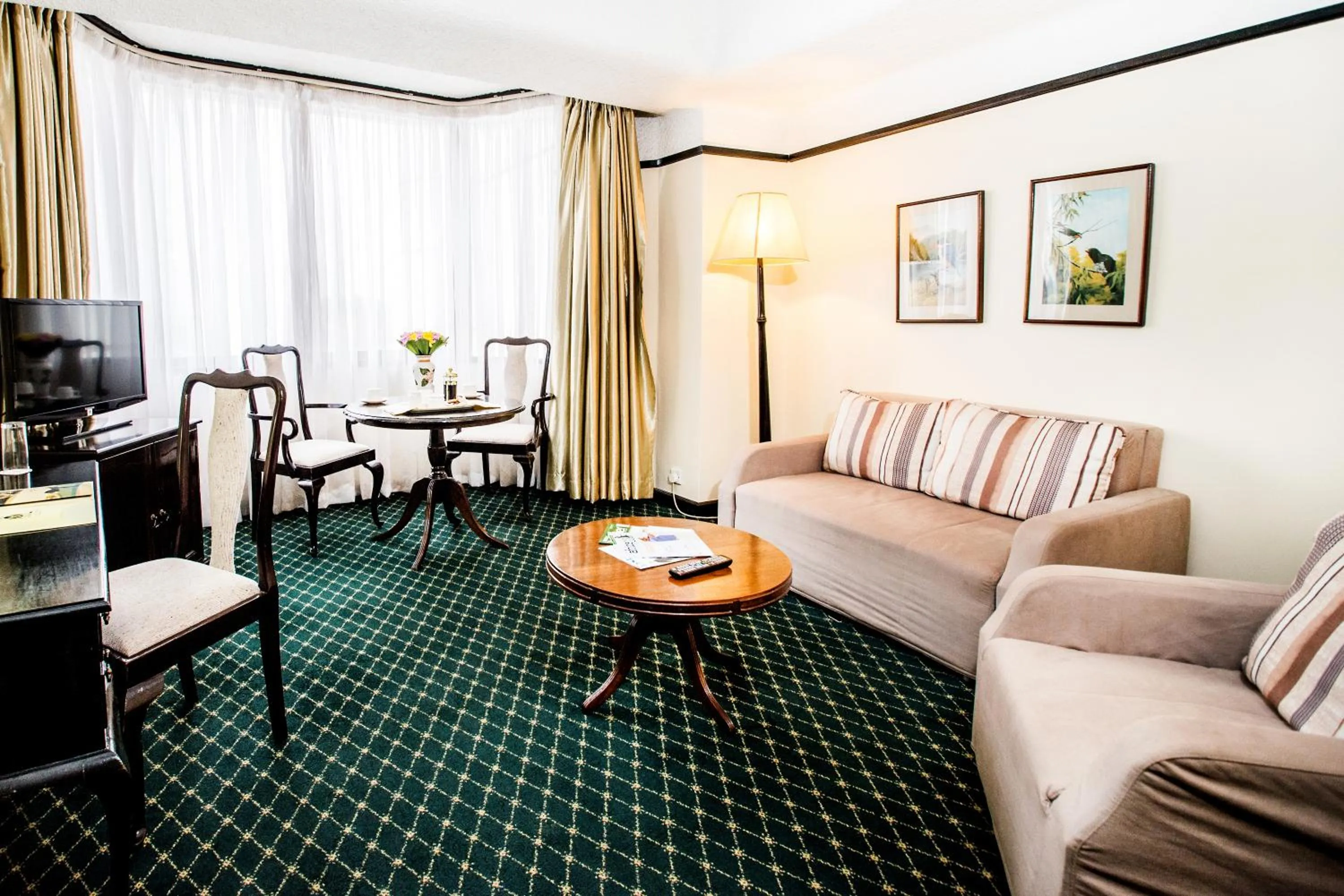 Living room in Nairobi Safari Club by Swiss-Belhotel