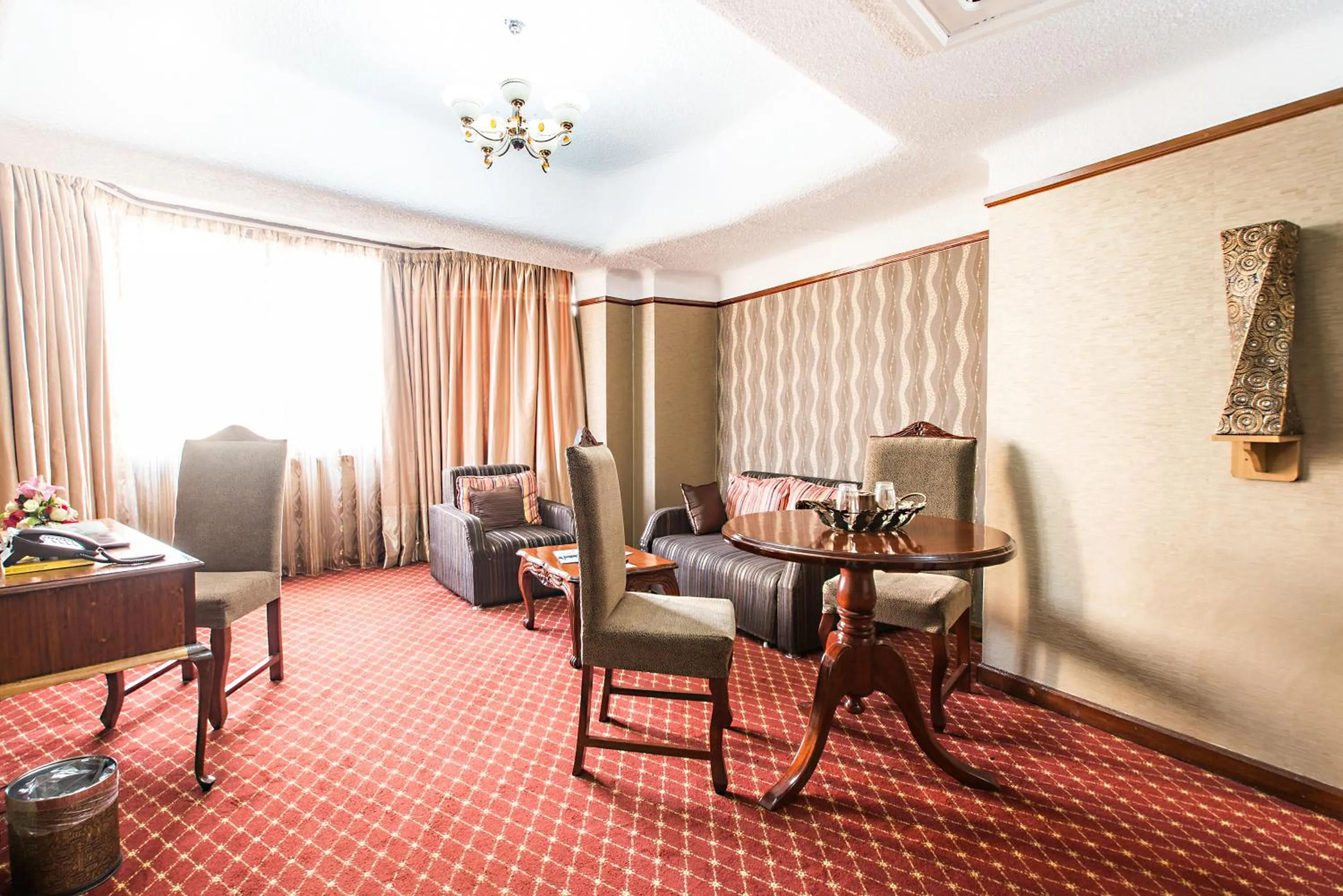 Living room in Nairobi Safari Club by Swiss-Belhotel