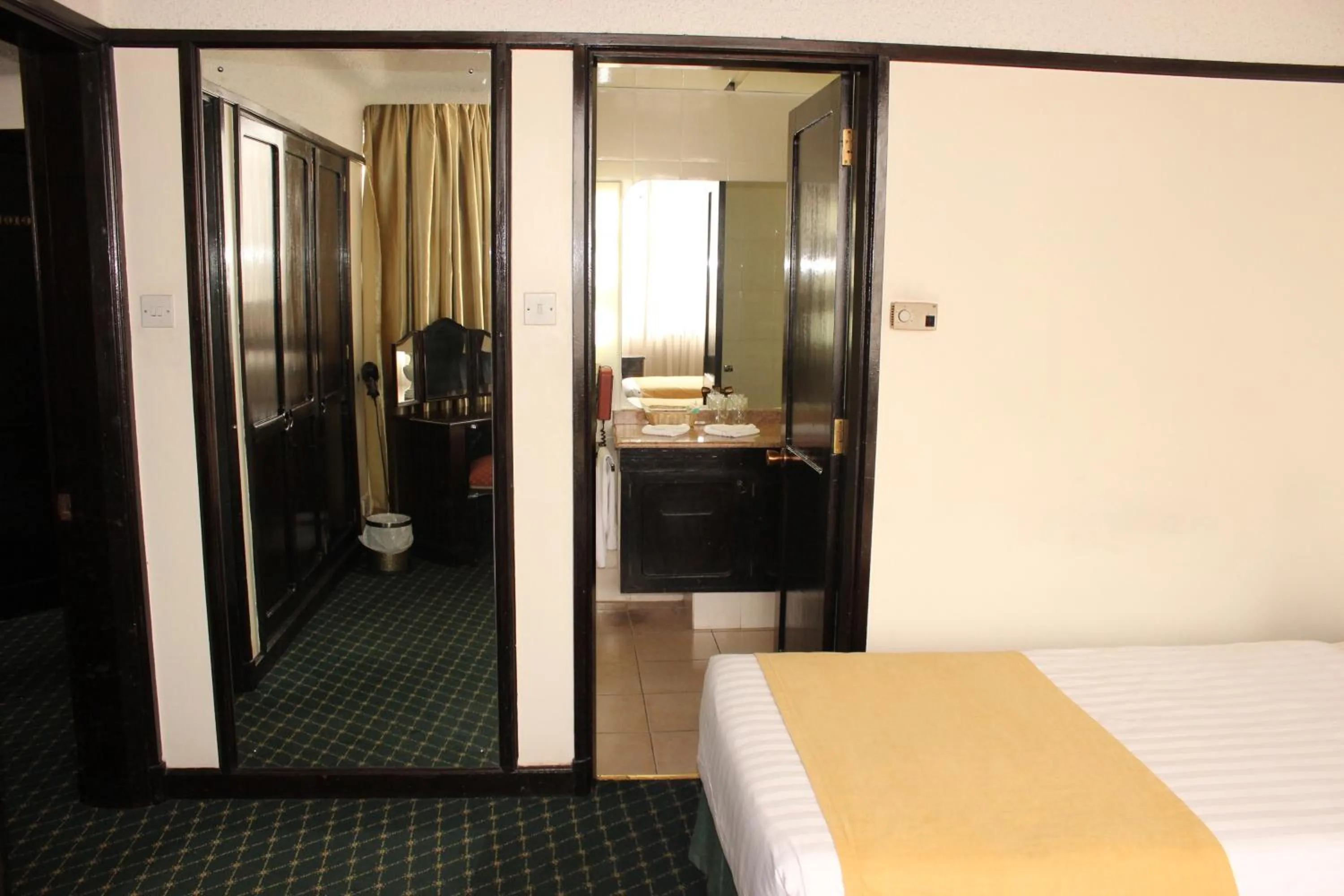 Bedroom, Bed in Nairobi Safari Club by Swiss-Belhotel