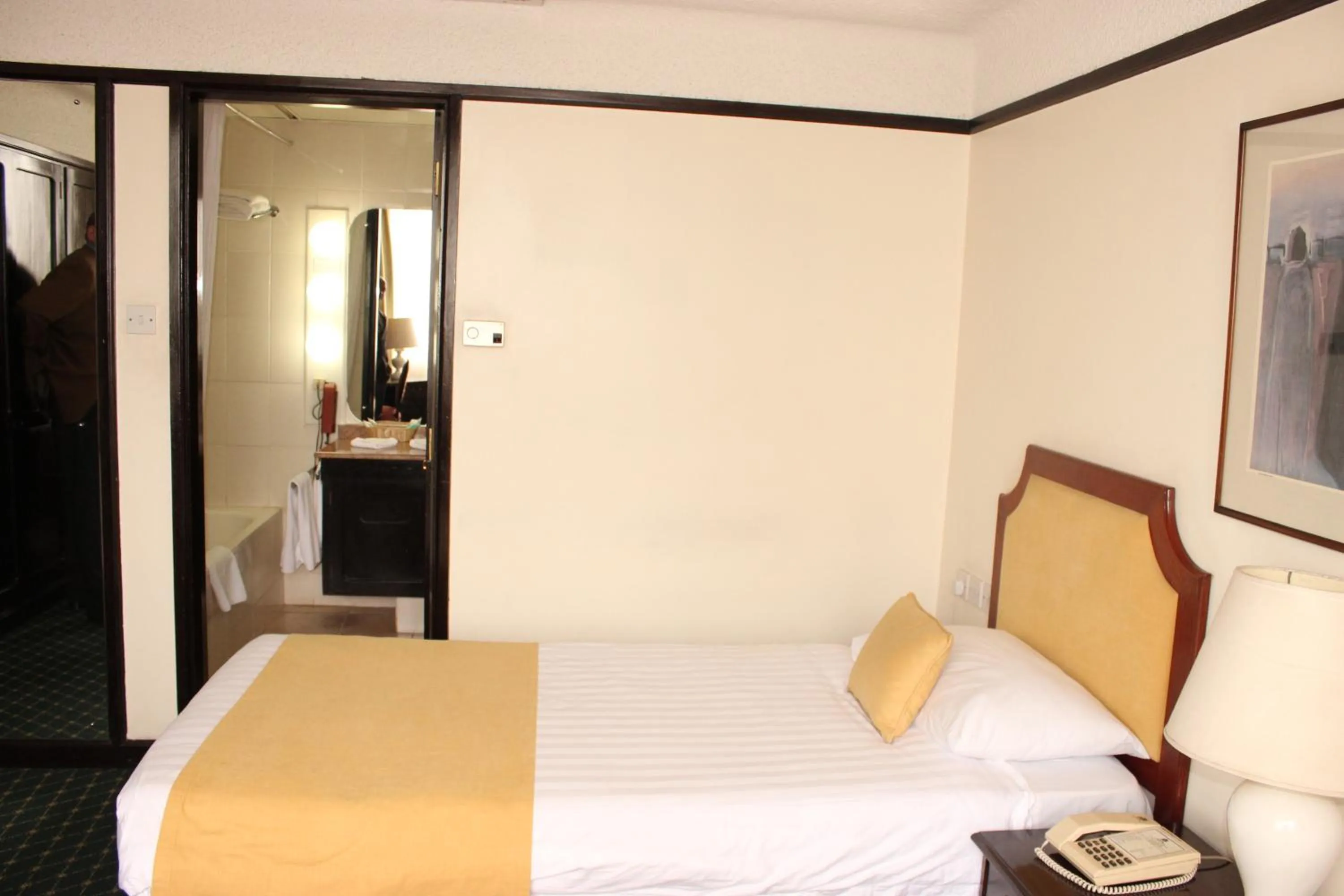 Bedroom, Bed in Nairobi Safari Club by Swiss-Belhotel