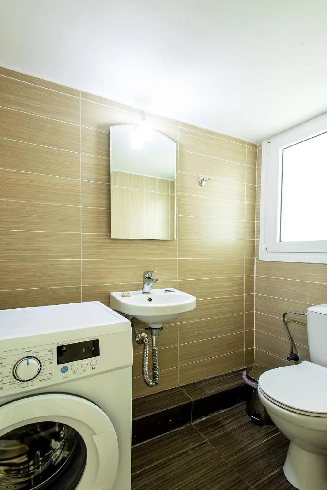 washing machine in Aris123 by Smart Cozy Suites - Apartments in the heart of Athens - 5 minutes from metro - Available 24hr