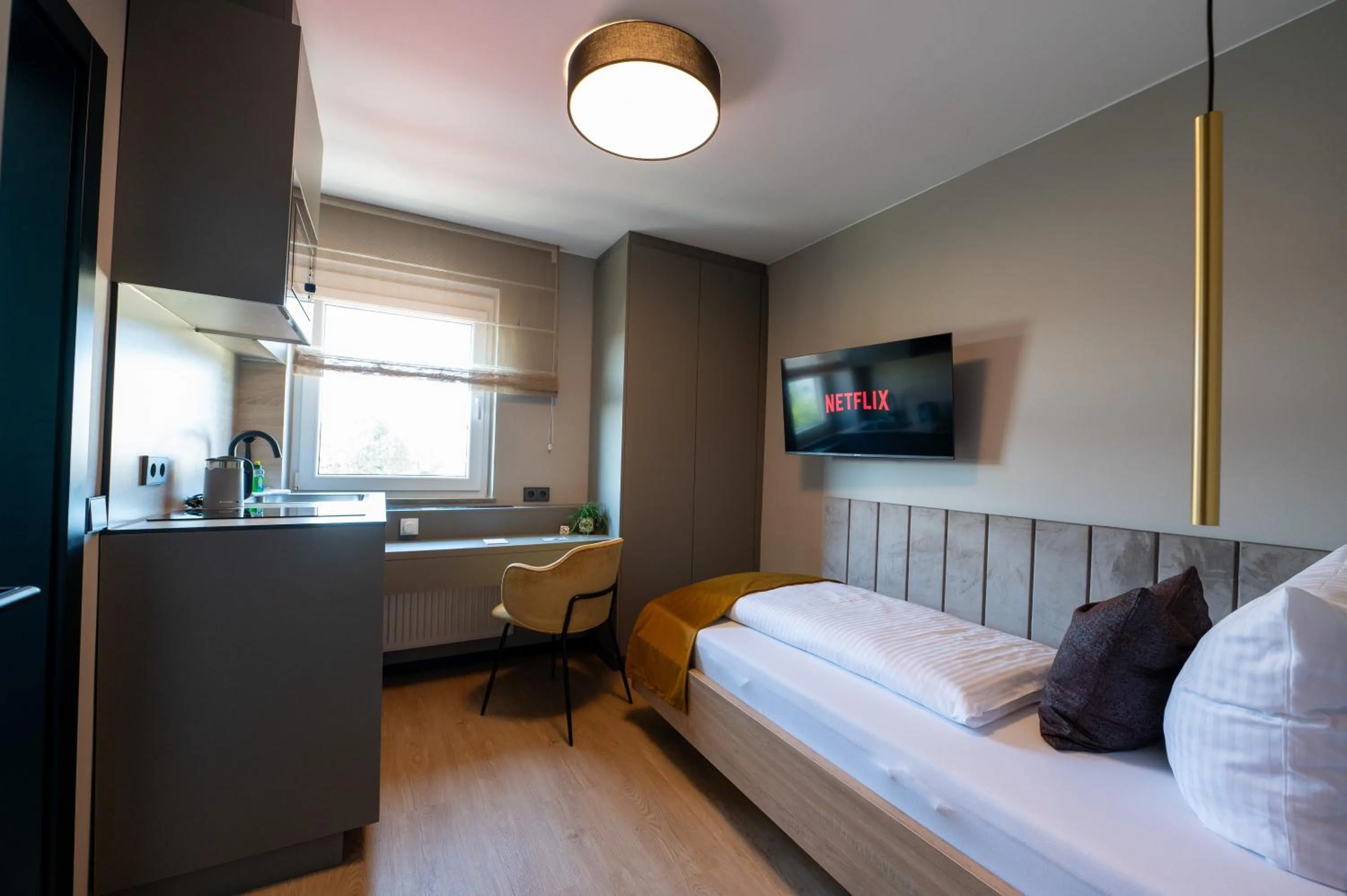 TV and multimedia, Bed in V Business Apartments Böblingen