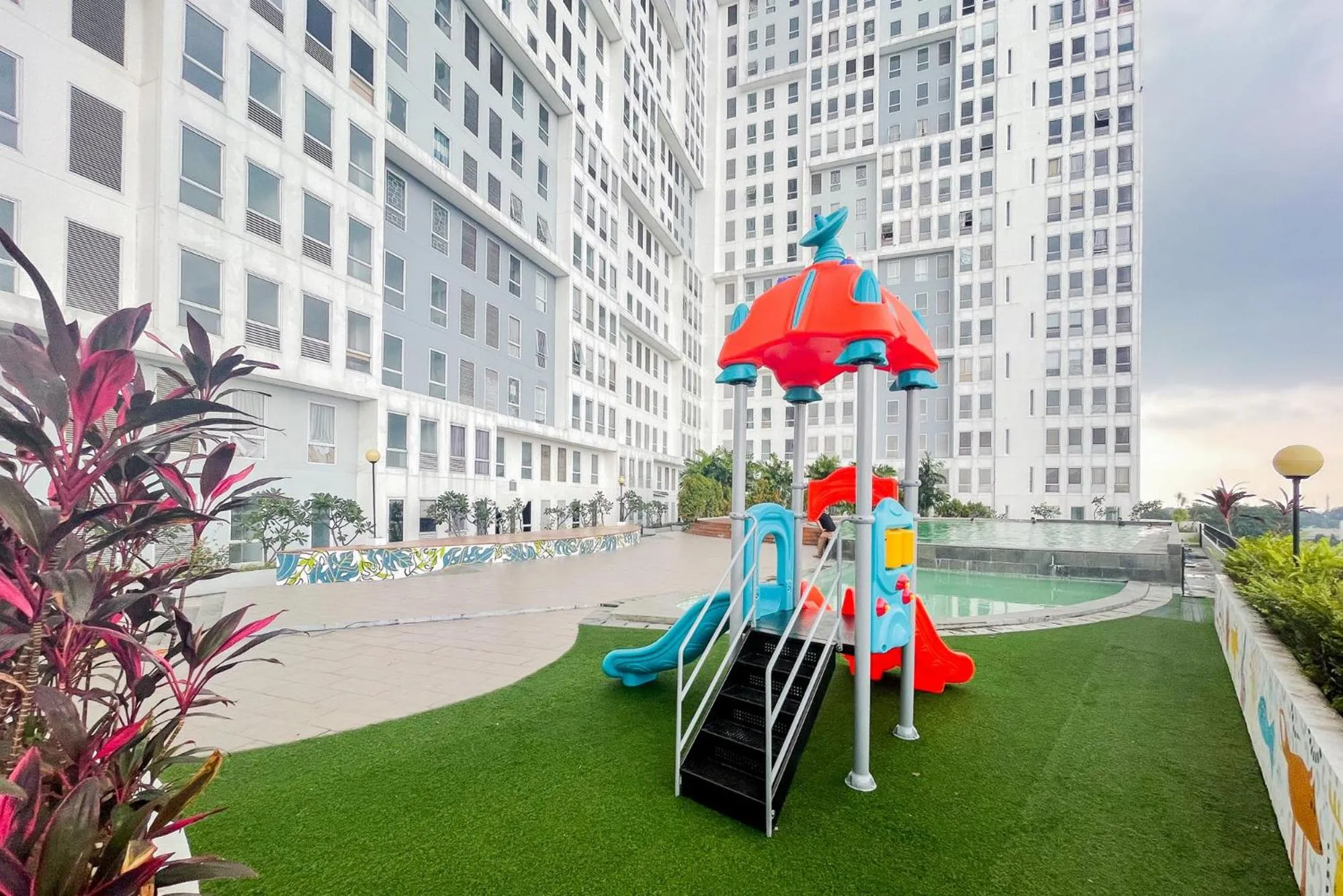 Property building in RedLiving Apartemen Patra Land Urbano - Happy Rooms Tower Mid-West with Netflix