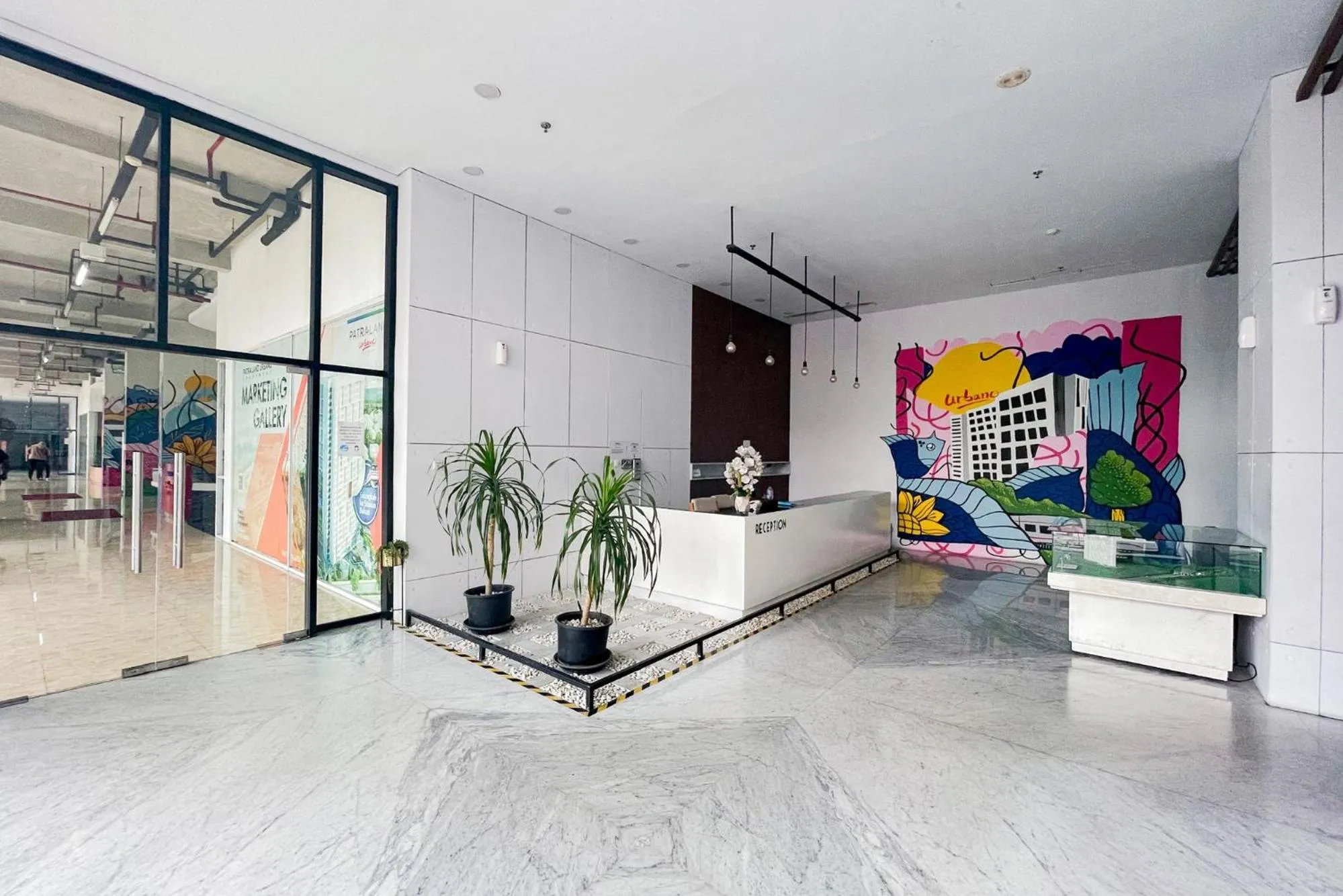 Property building in RedLiving Apartemen Patra Land Urbano - Happy Rooms Tower Mid-West with Netflix