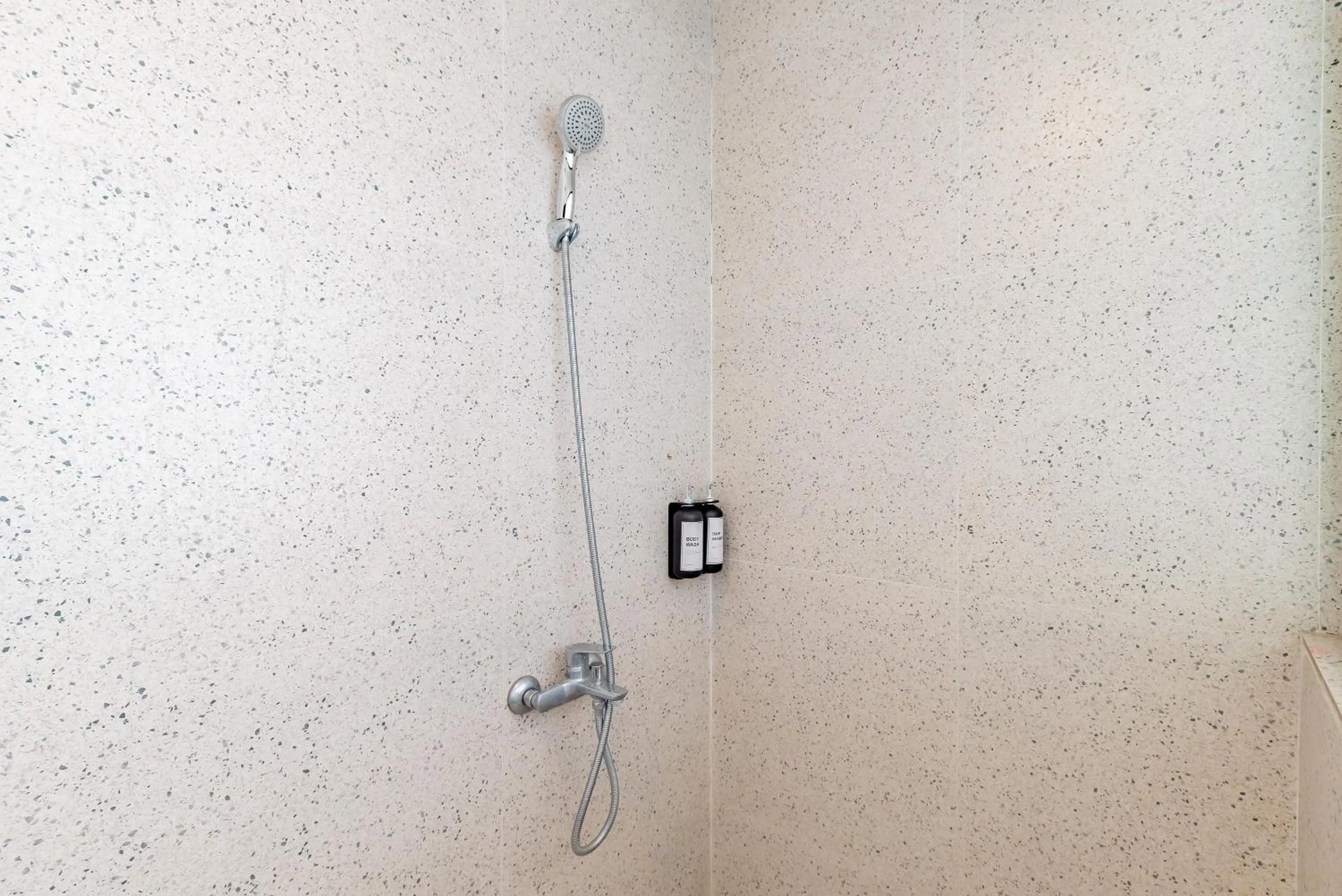 Bathroom in Sans Hotel Bobosini Malang by RedDoorz