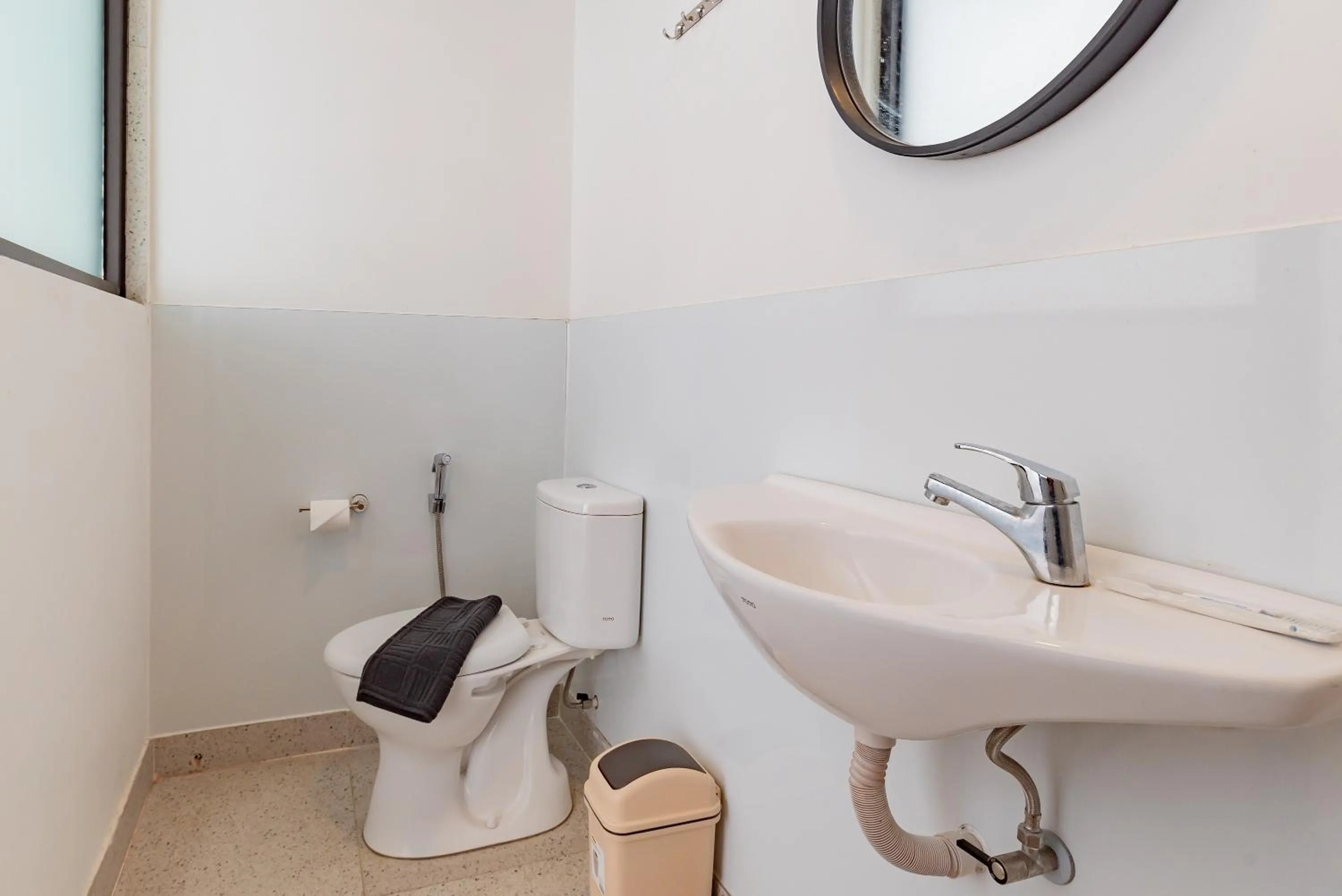 Bathroom in Sans Hotel Bobosini Malang by RedDoorz