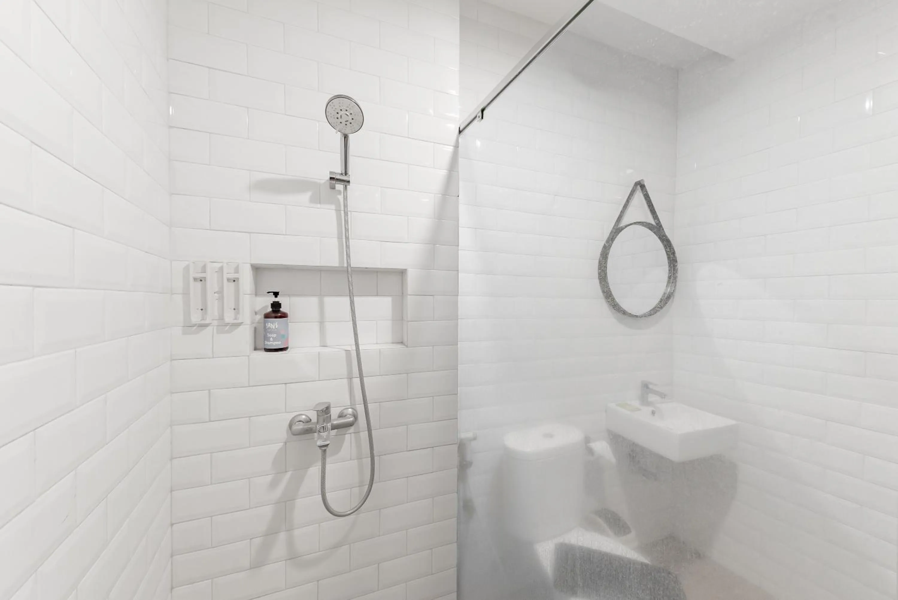 Bathroom in Sans Hotel Bobosini Malang by RedDoorz