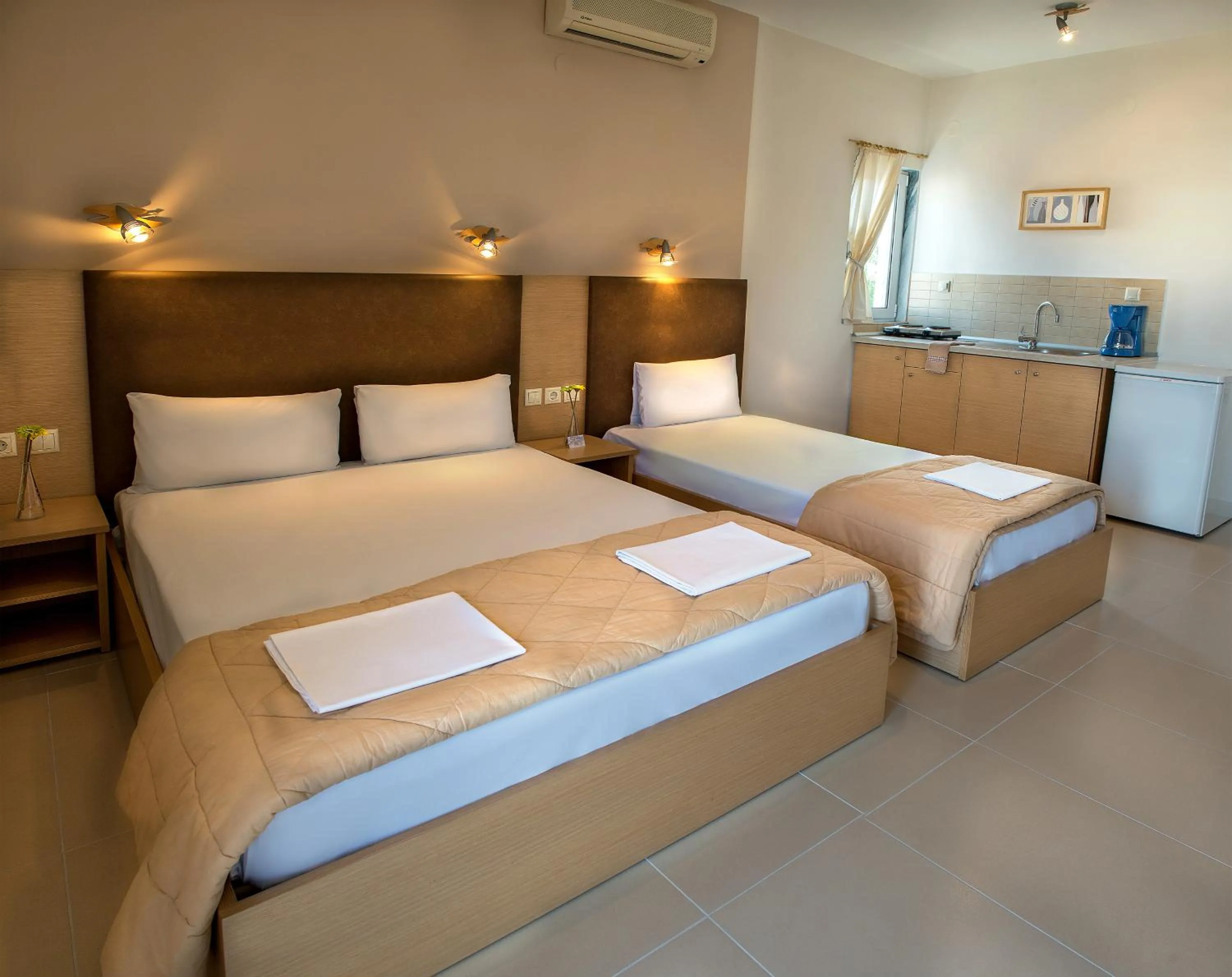 Kitchen or kitchenette, Bed in Nepheli Apartments and Studios