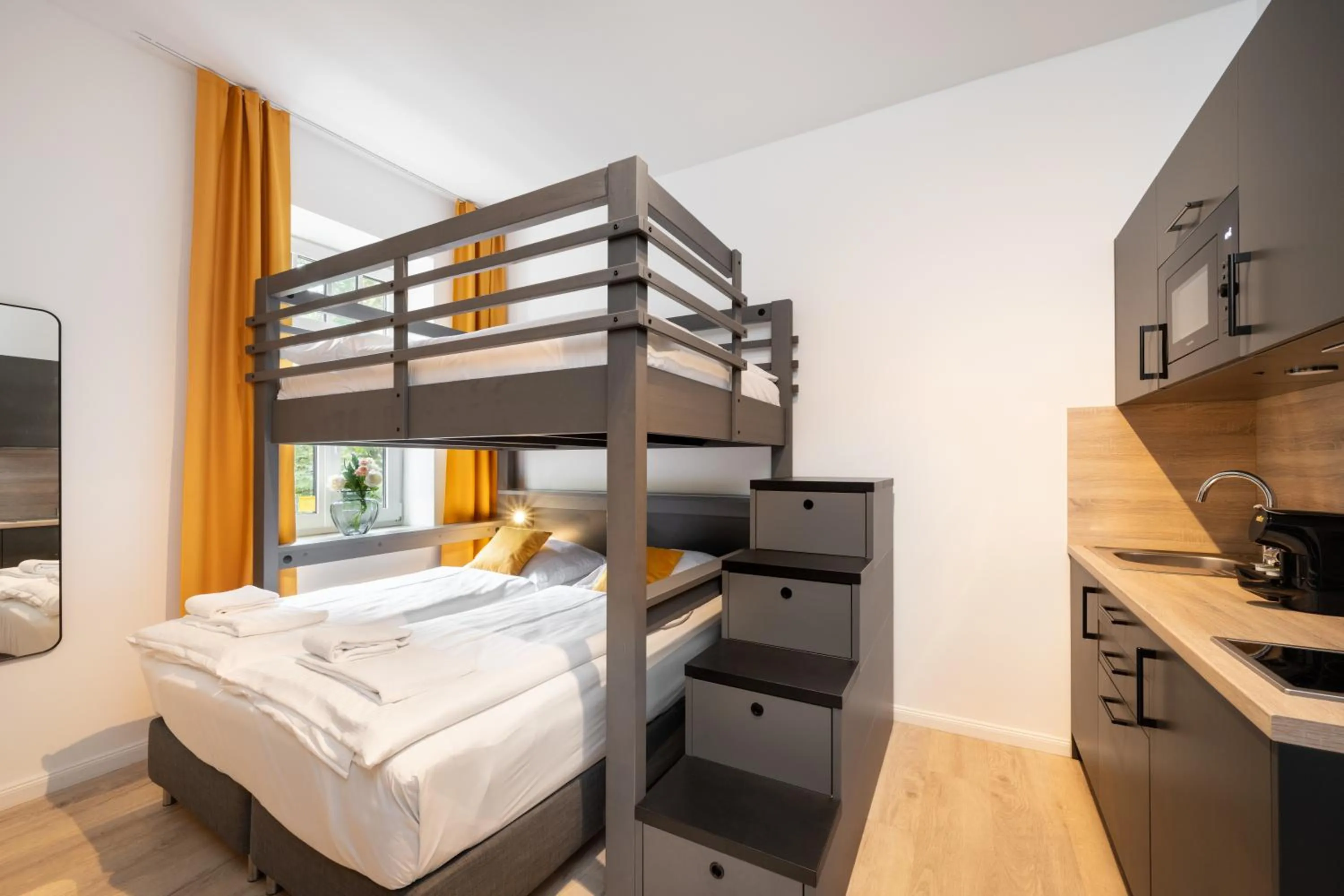 Bed in Servus Apartments by Homaris