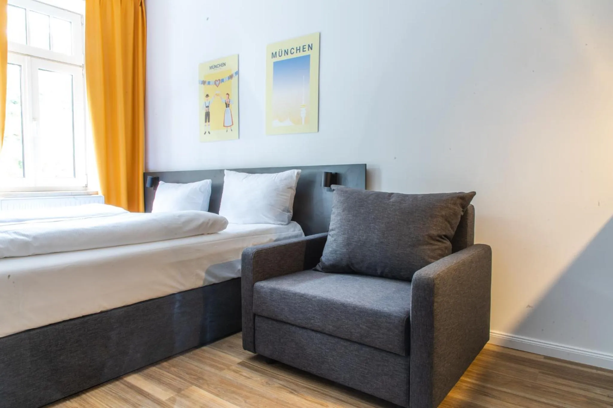 Bed in Servus Apartments by Homaris