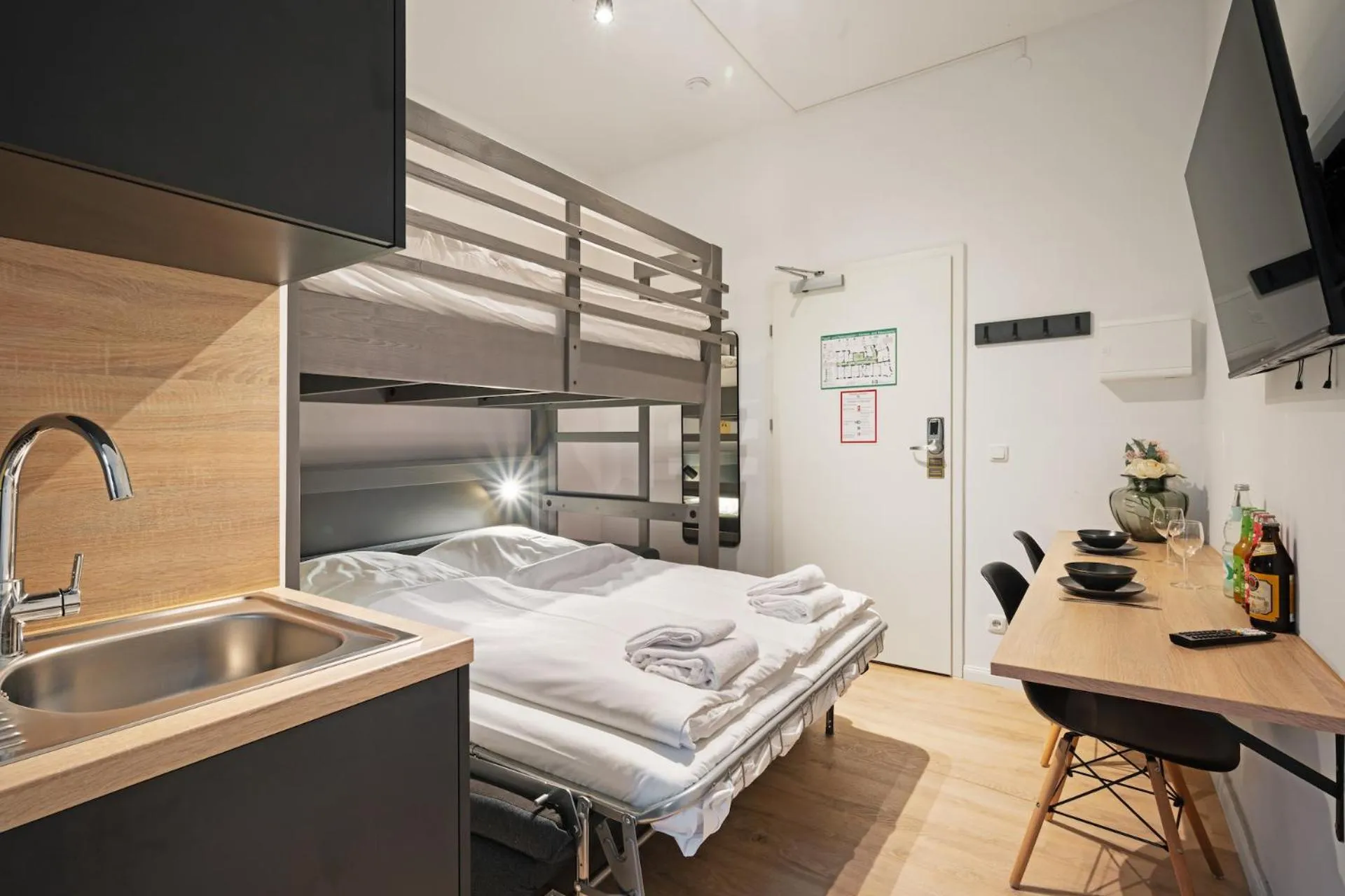 Bed in Servus Apartments by Homaris